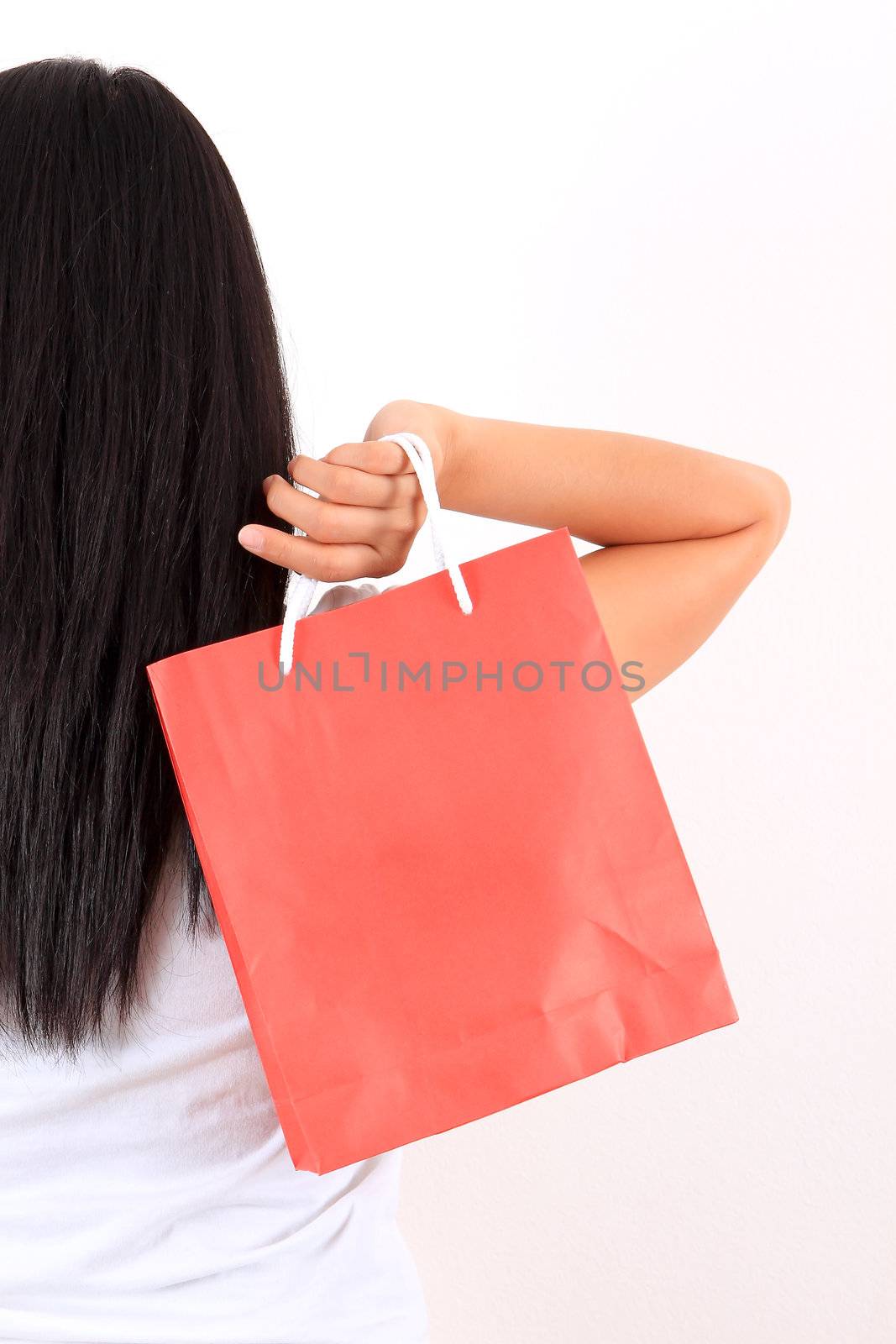 Young model with shopping bag in hands