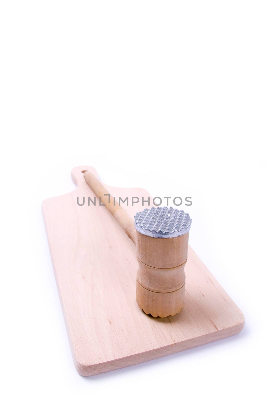 Wooden meat hammer on kitchen board isolated on white background.