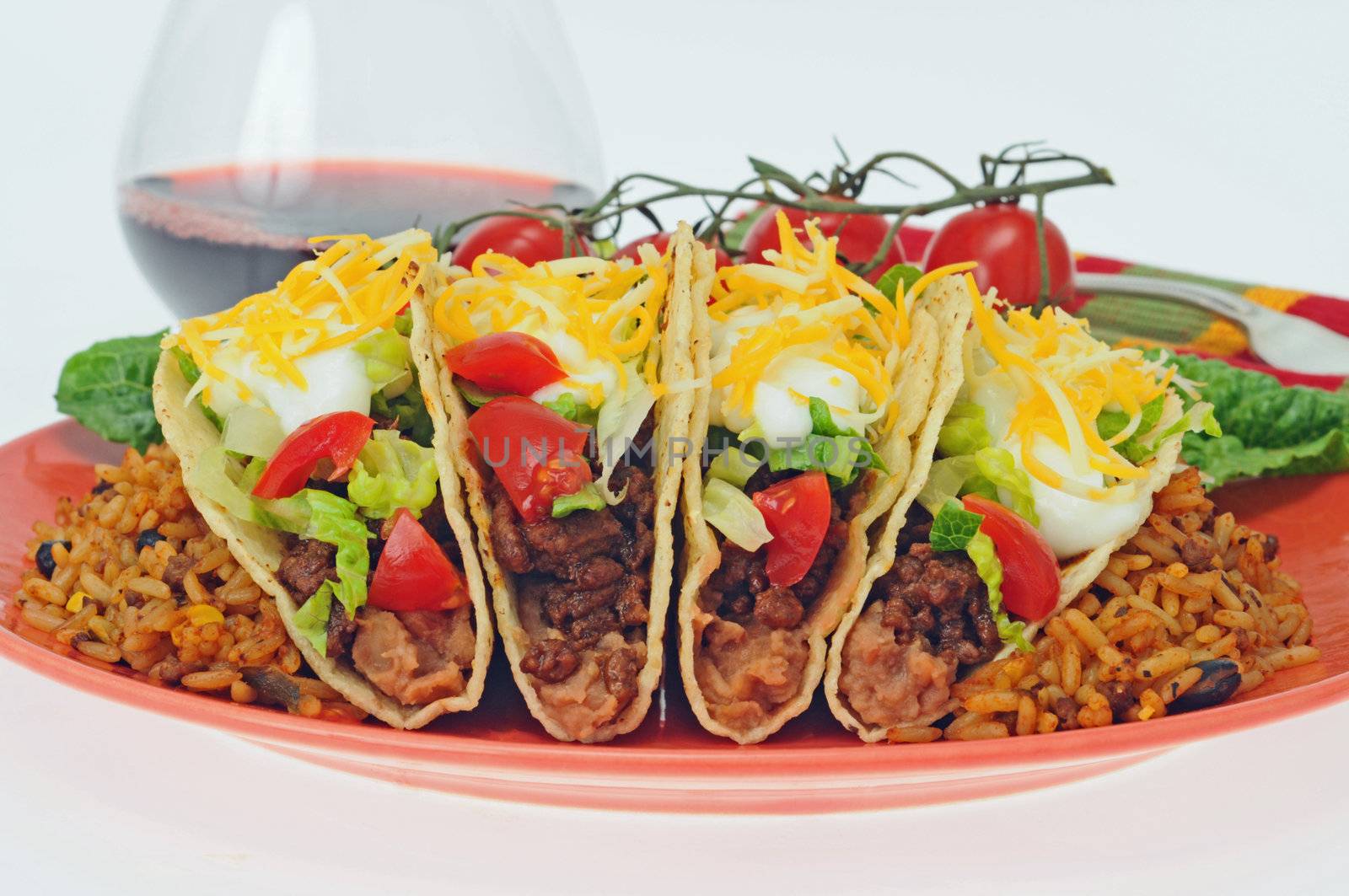 Delicious tacos served with mexican style rice.