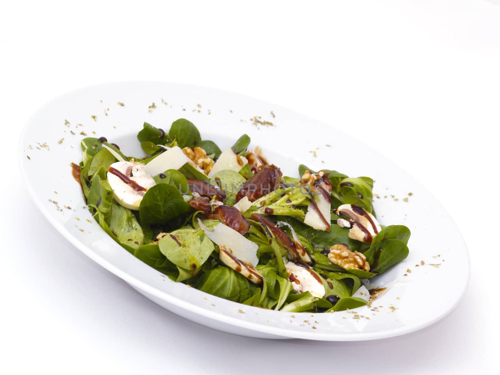 lamb's lettuce with dates, walnuts, champignos and parmesan cheese