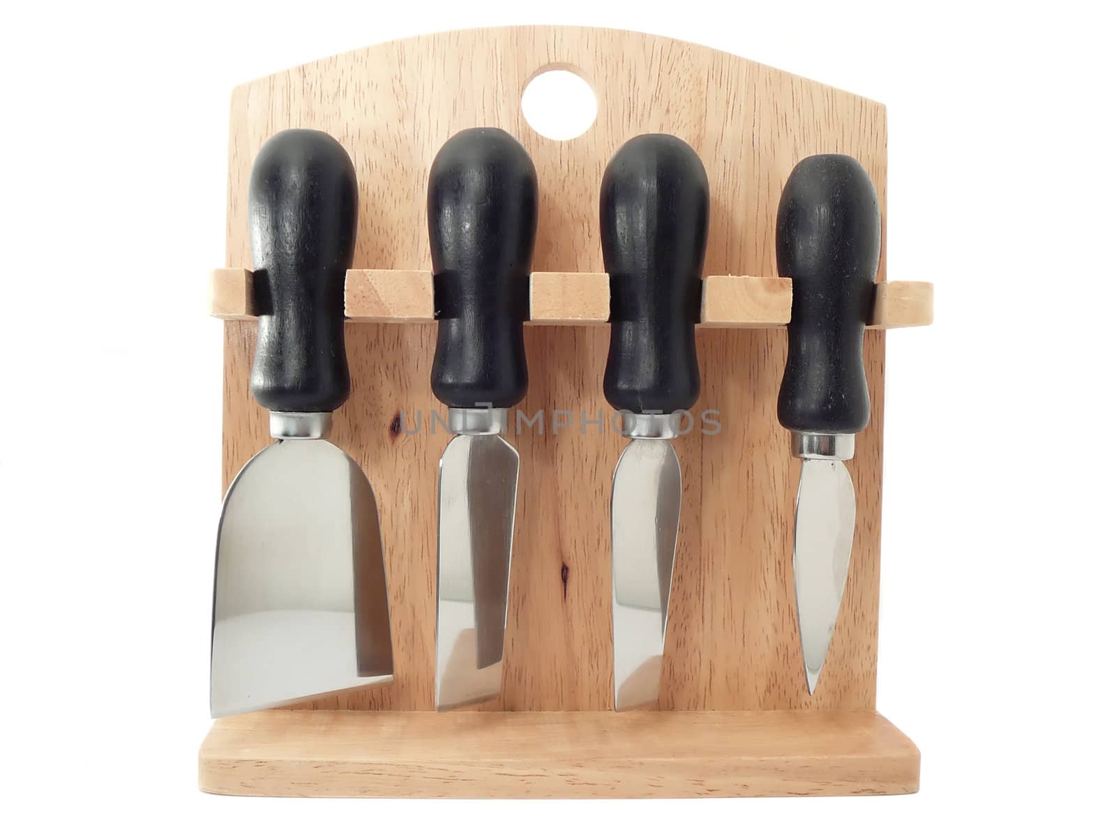 set of knifes for cheese and a chopping board