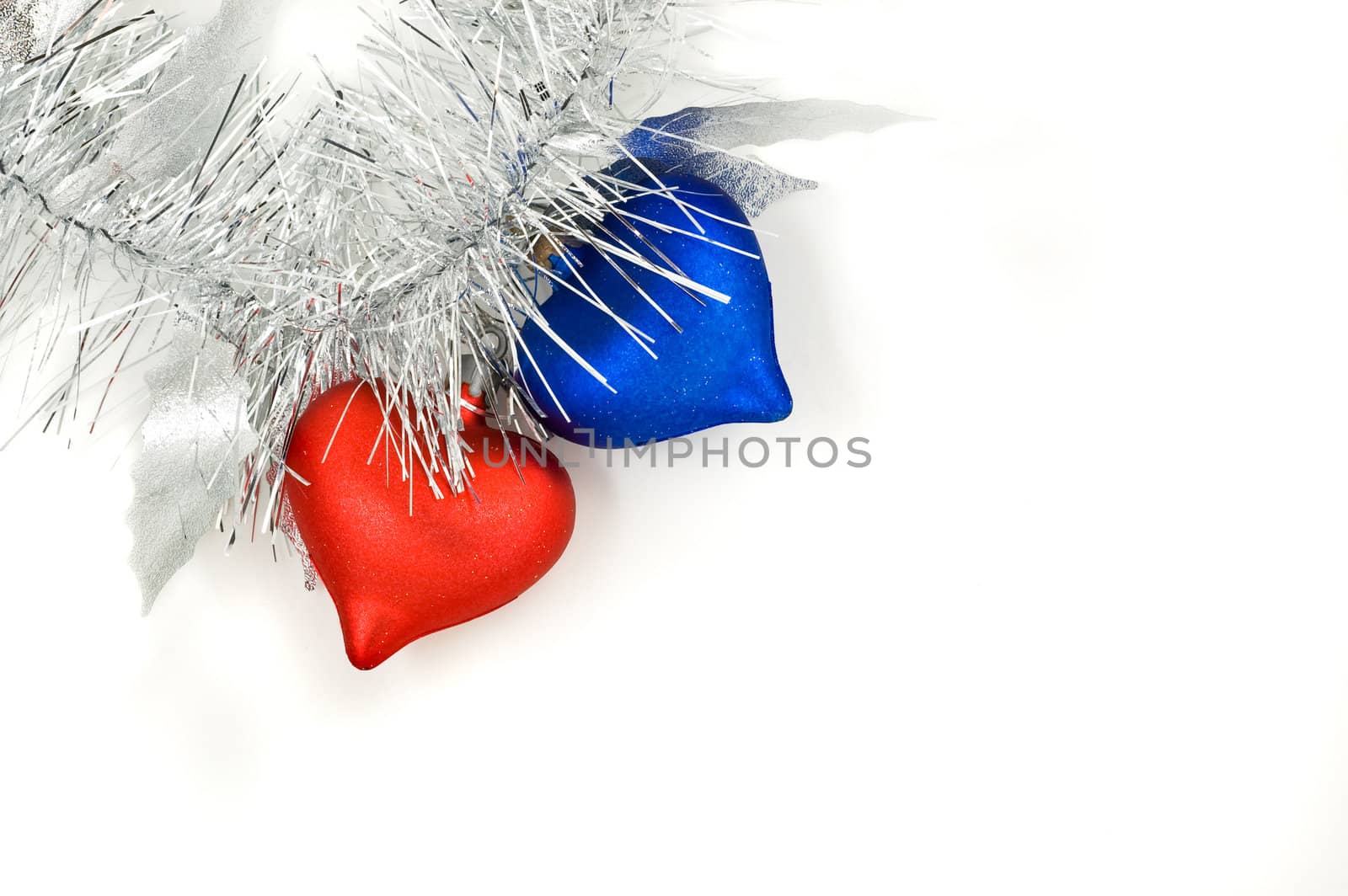 Christmas red and blue hearts ornament, on white background.