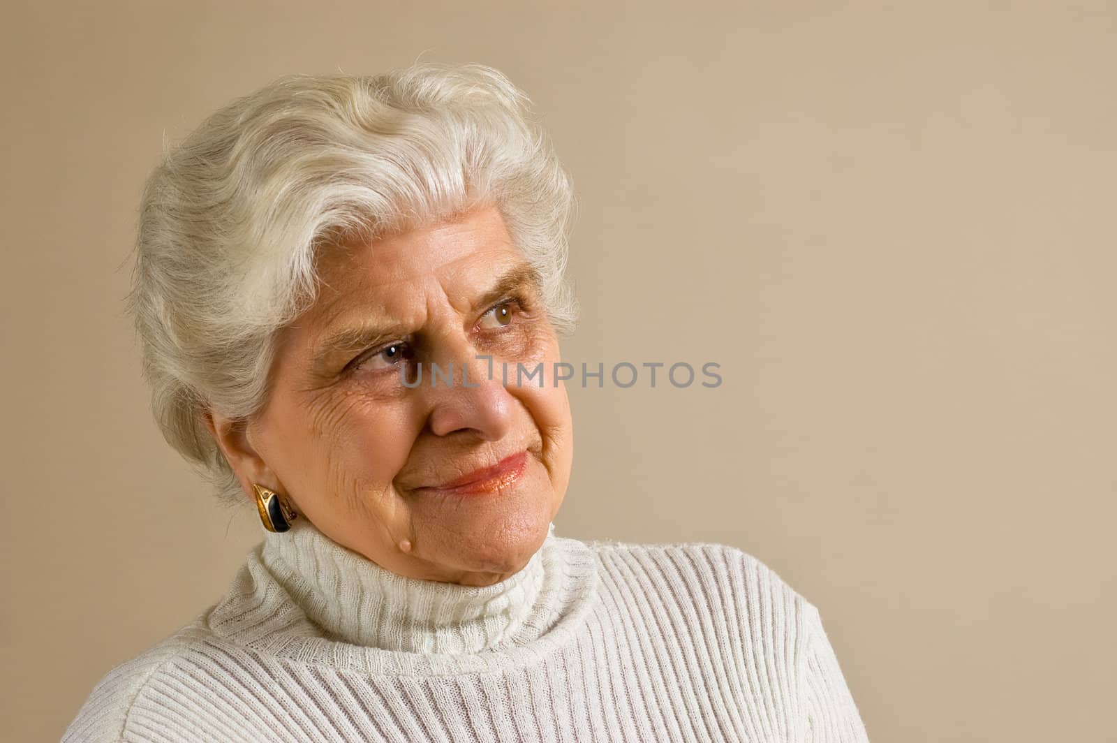 Senior lady portrait, smiling, with copy space.