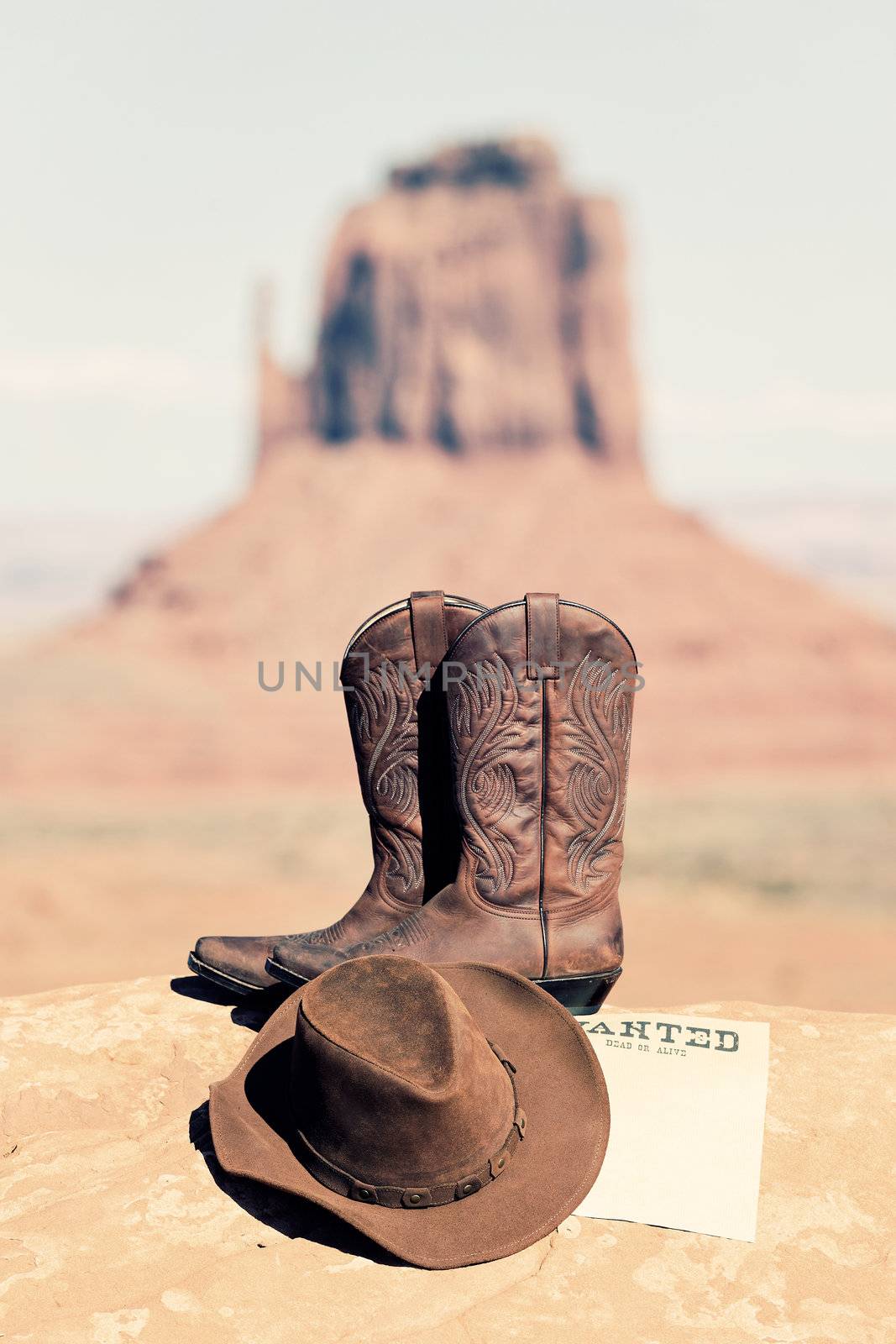 vintage wanted poster, boots and hat in Monument Valley