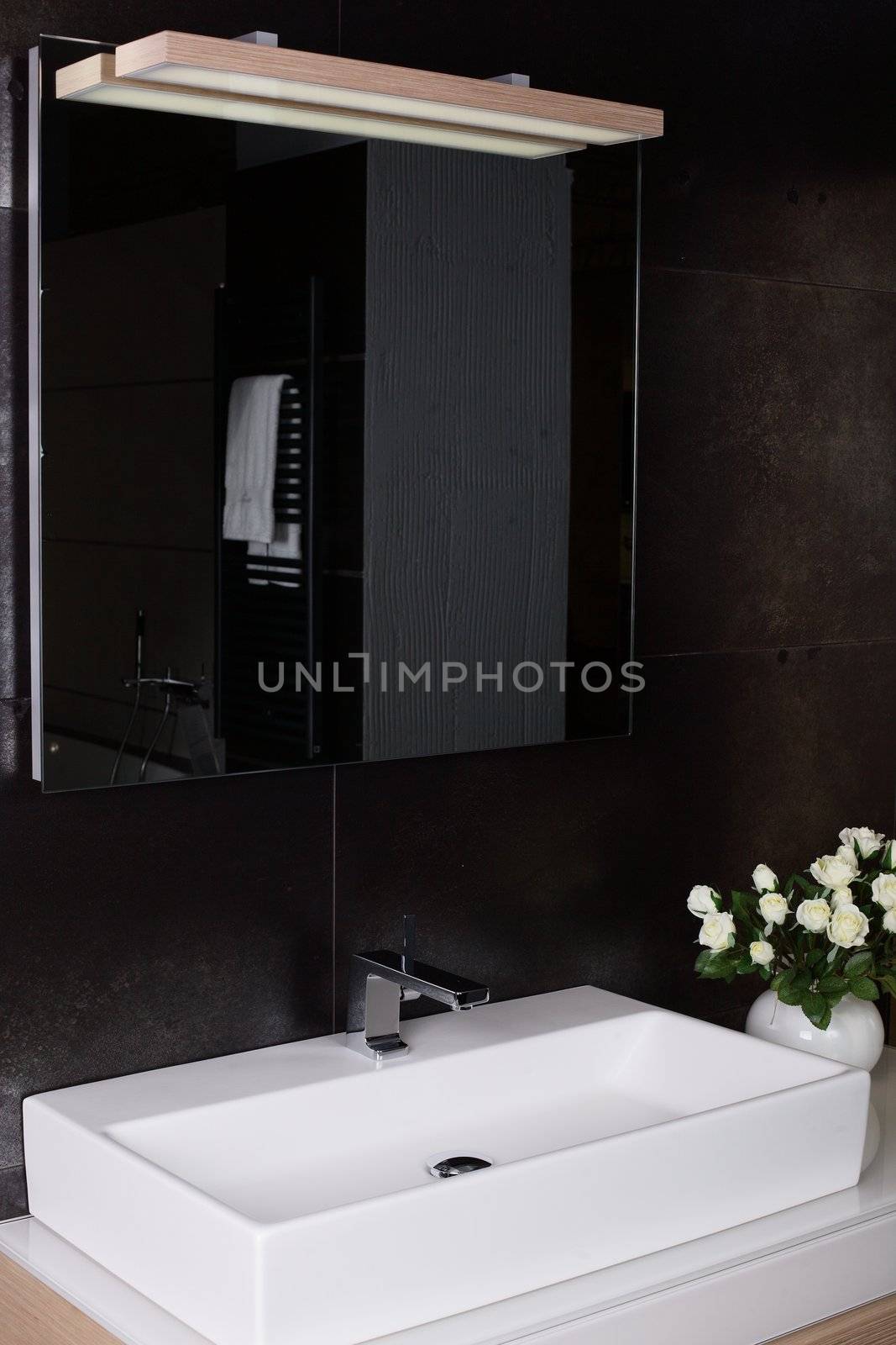 Interior of brand new bathroom with mirror