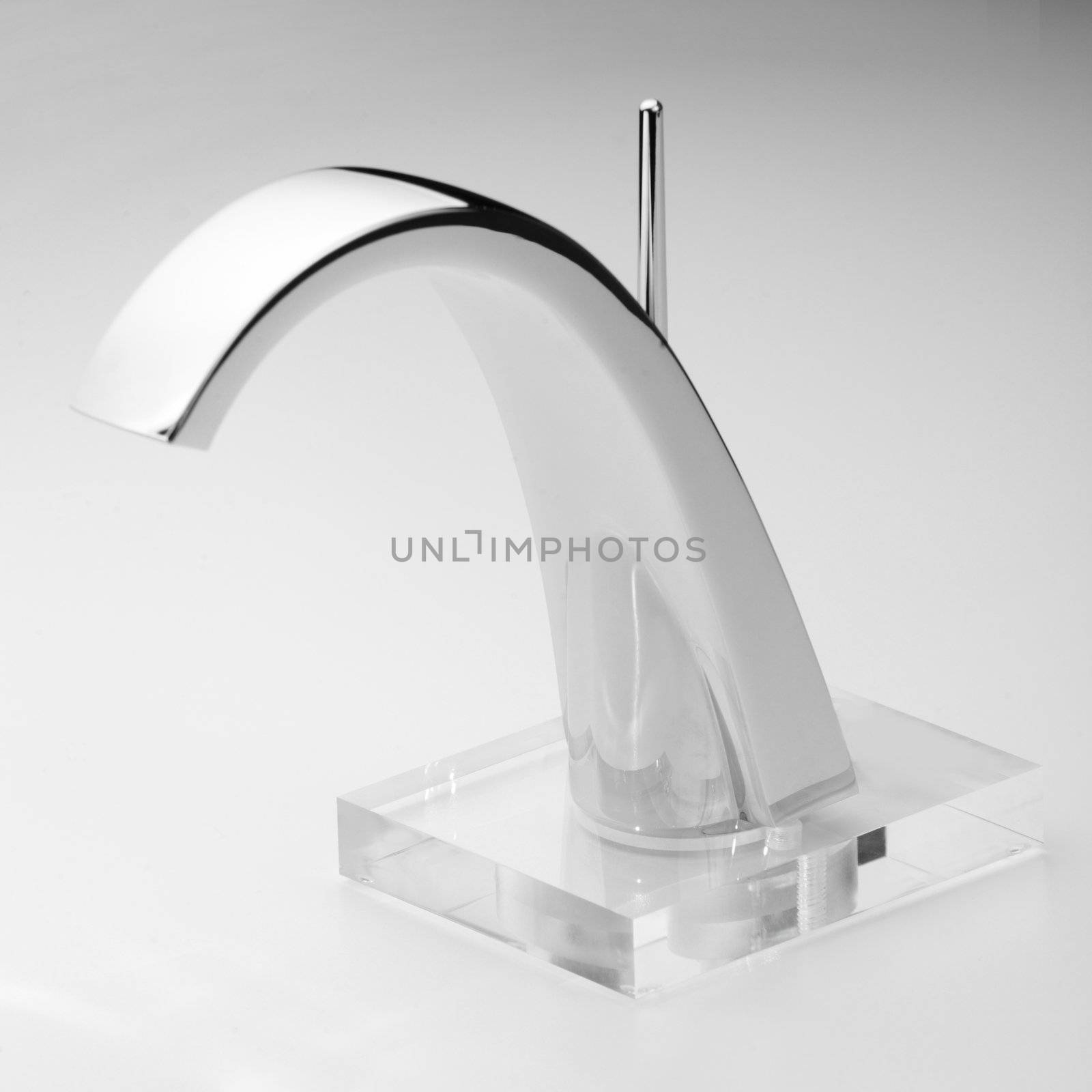 Brand new water tap on bright background