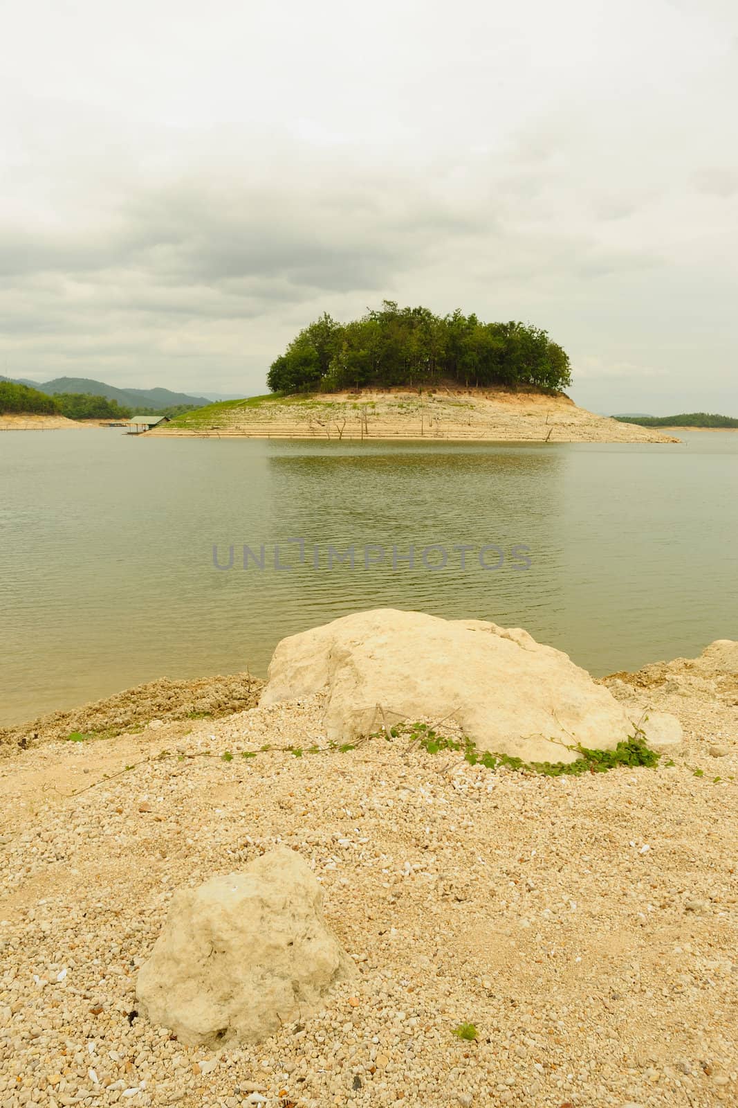 Landscape lakeside beach on a cloudy day.