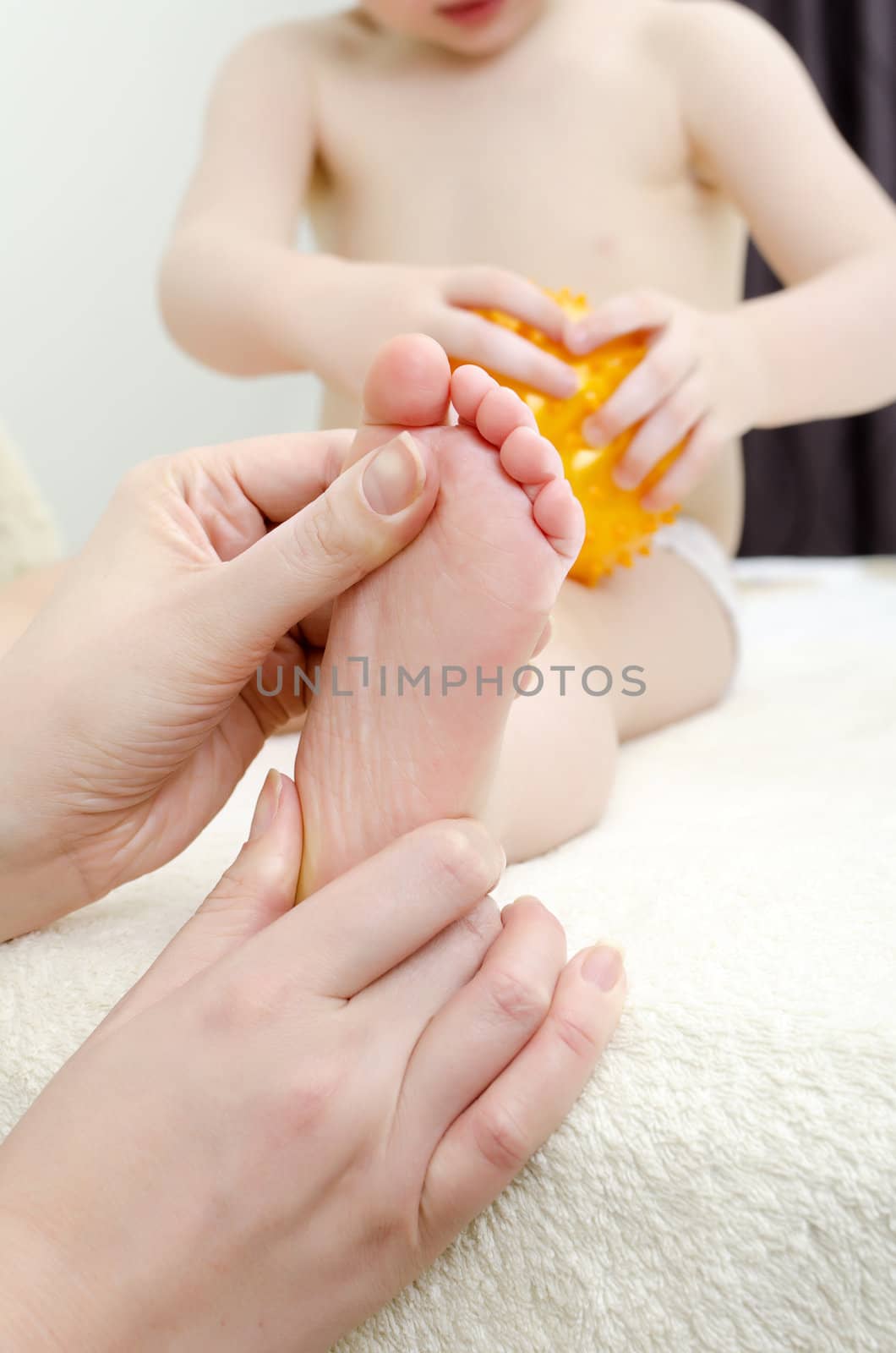 Therapist makes a child massage. Close-up