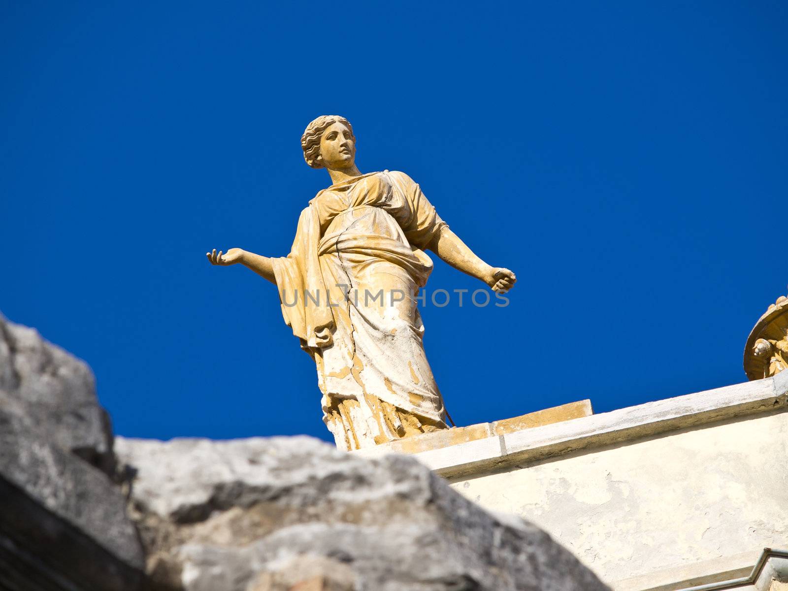 antic sculpture and the blue sky