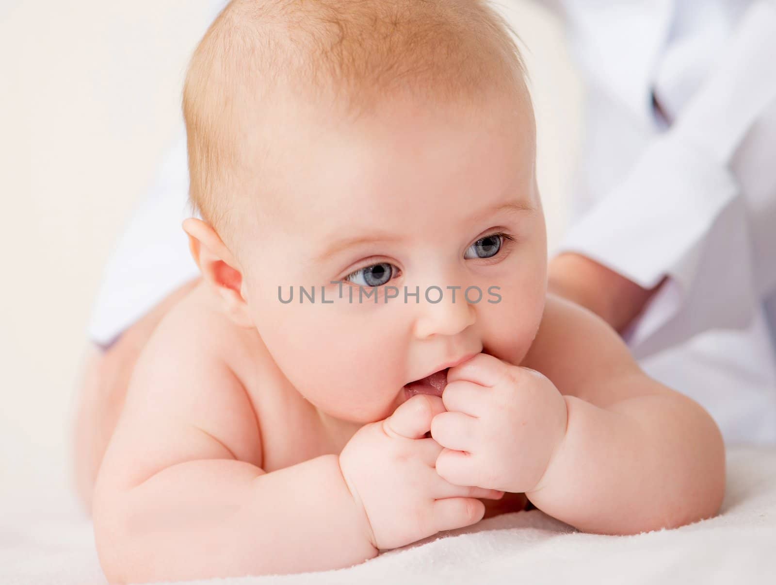 Doctorr's hands massaging little baby