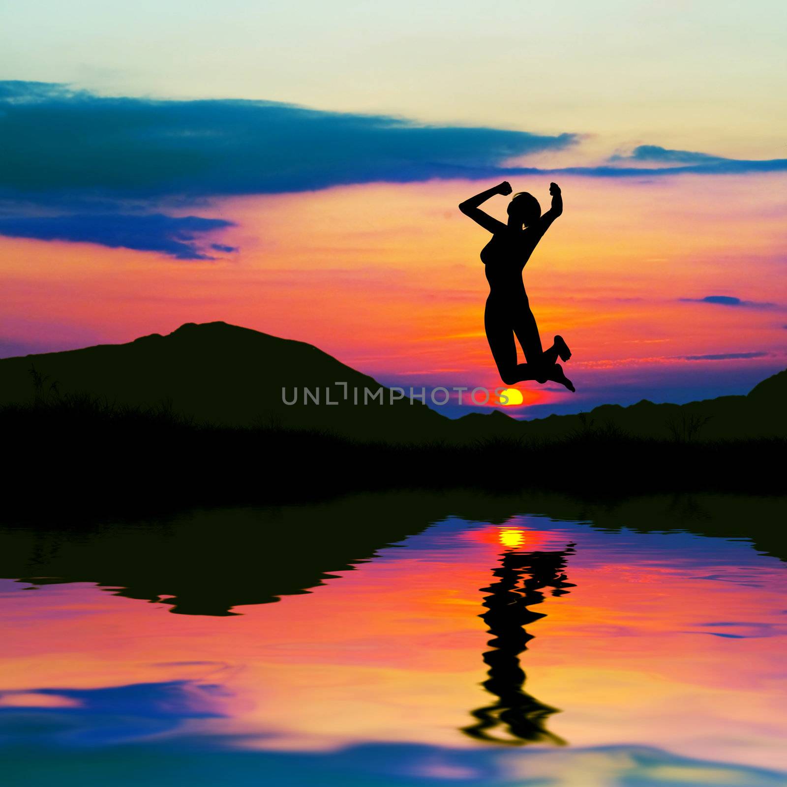 Silhouette of a happy woman jumping for joy at sunset. Water reflection