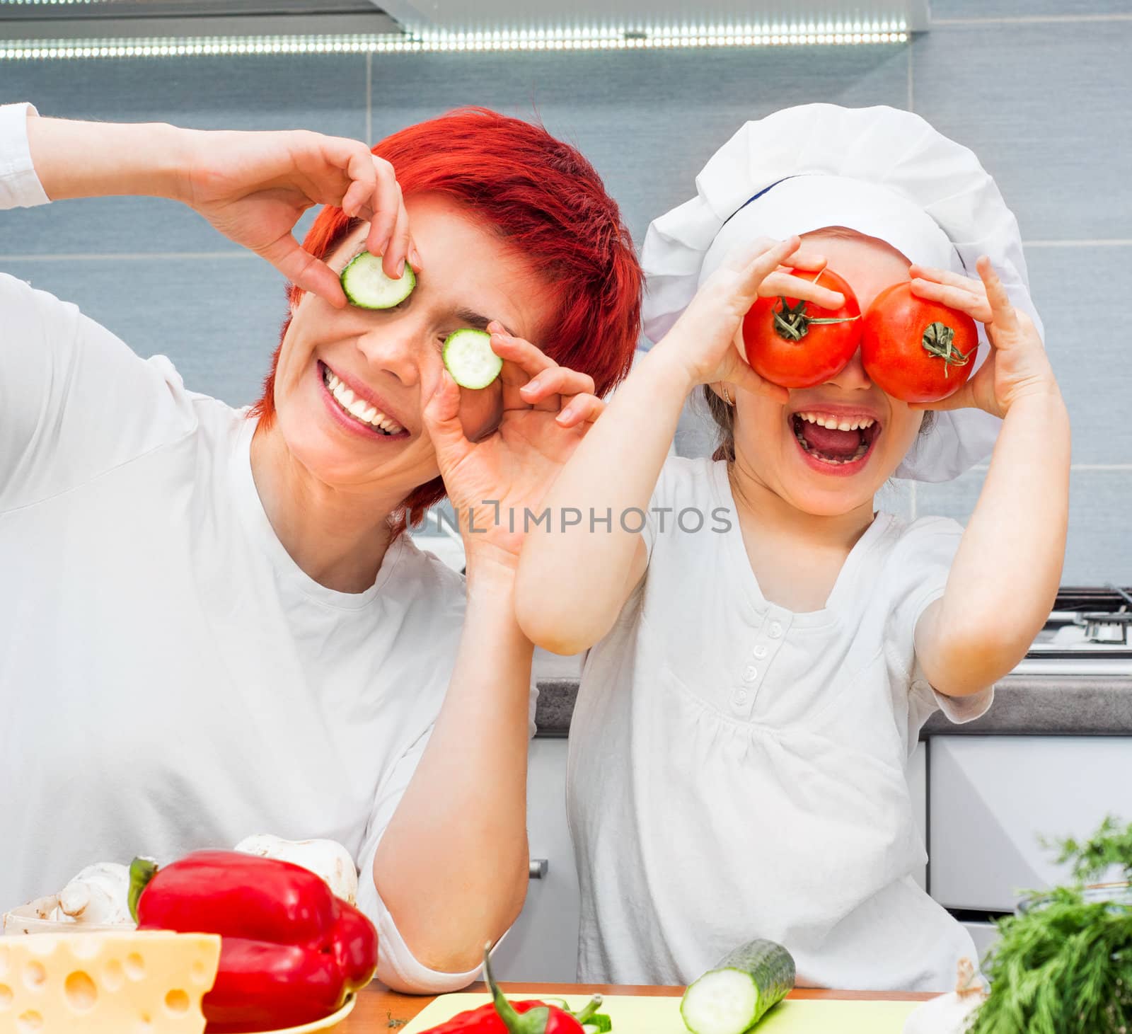 Mother and daughter in the kitchen by GekaSkr