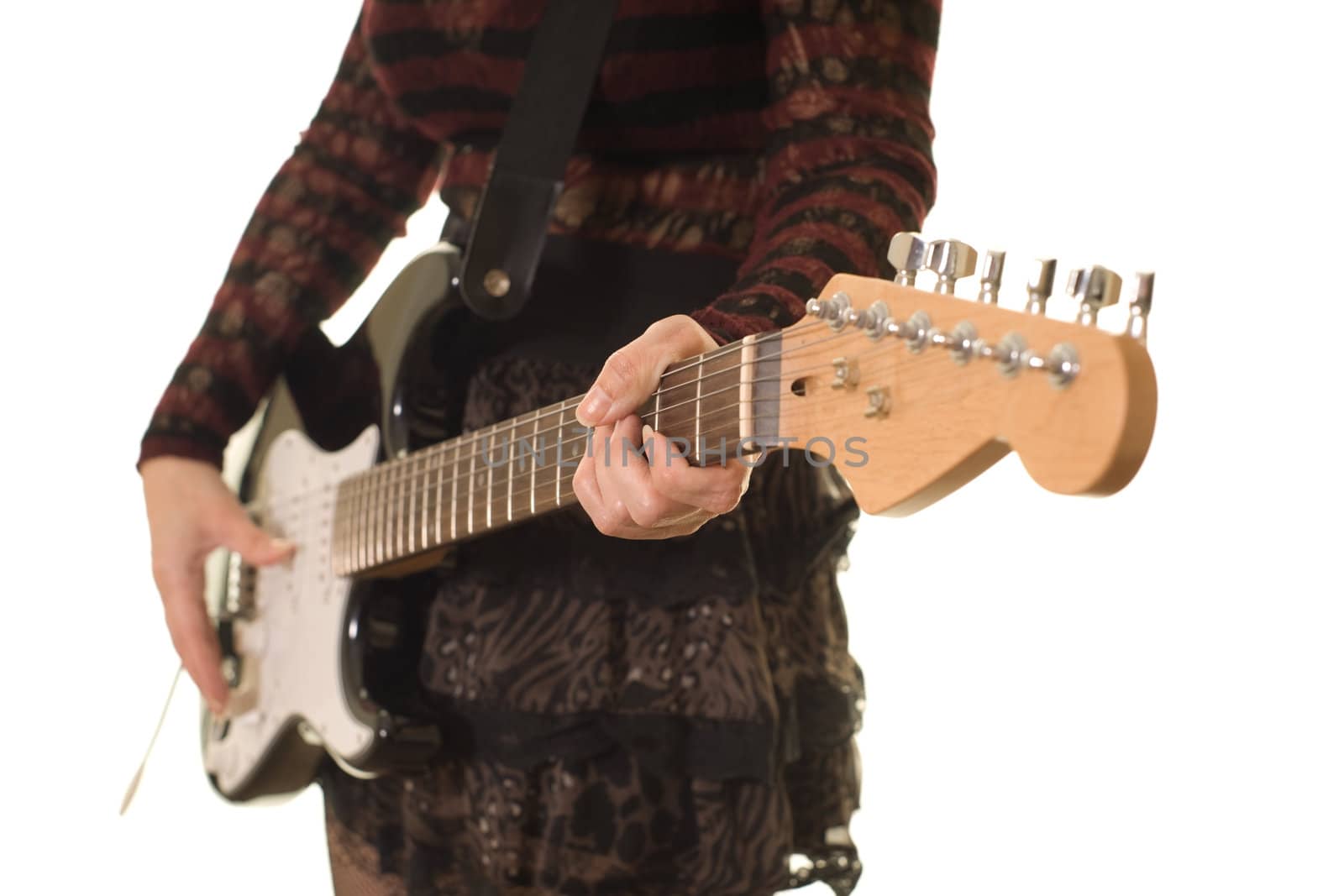 close up of a womans hands playing guitar, shallow depth of field