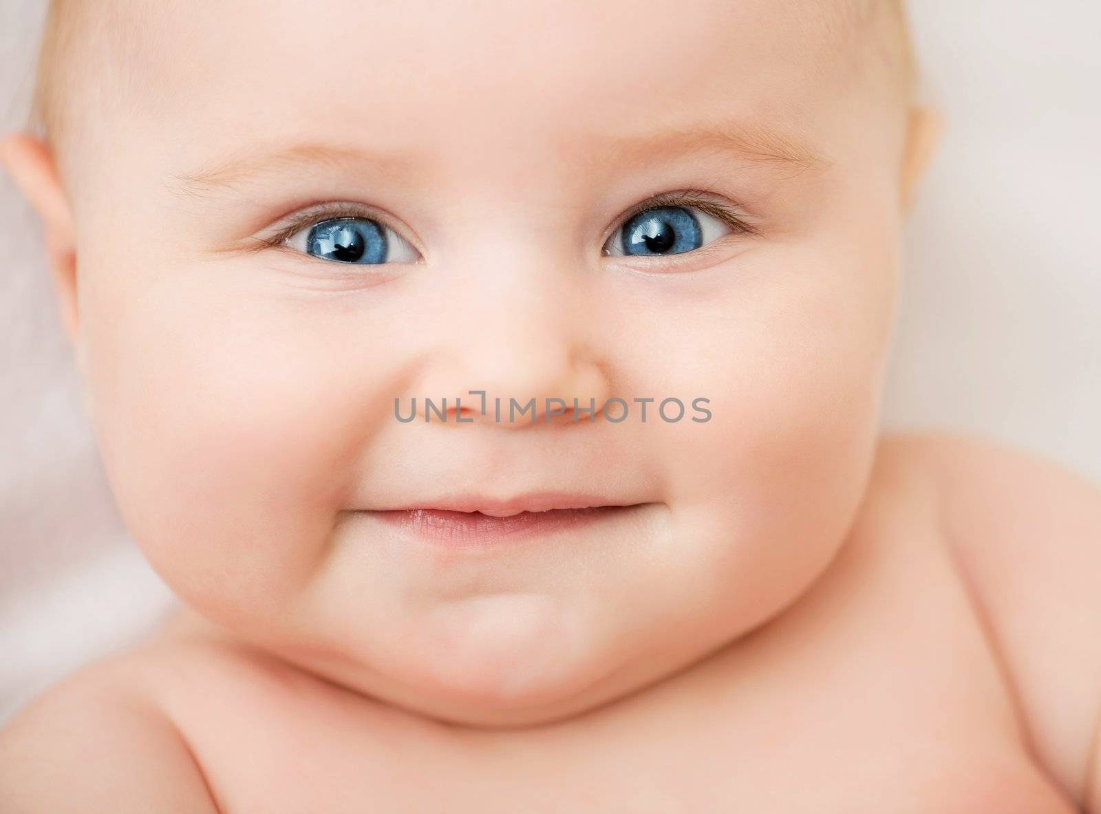 bright closeup portrait of smiling adorable baby