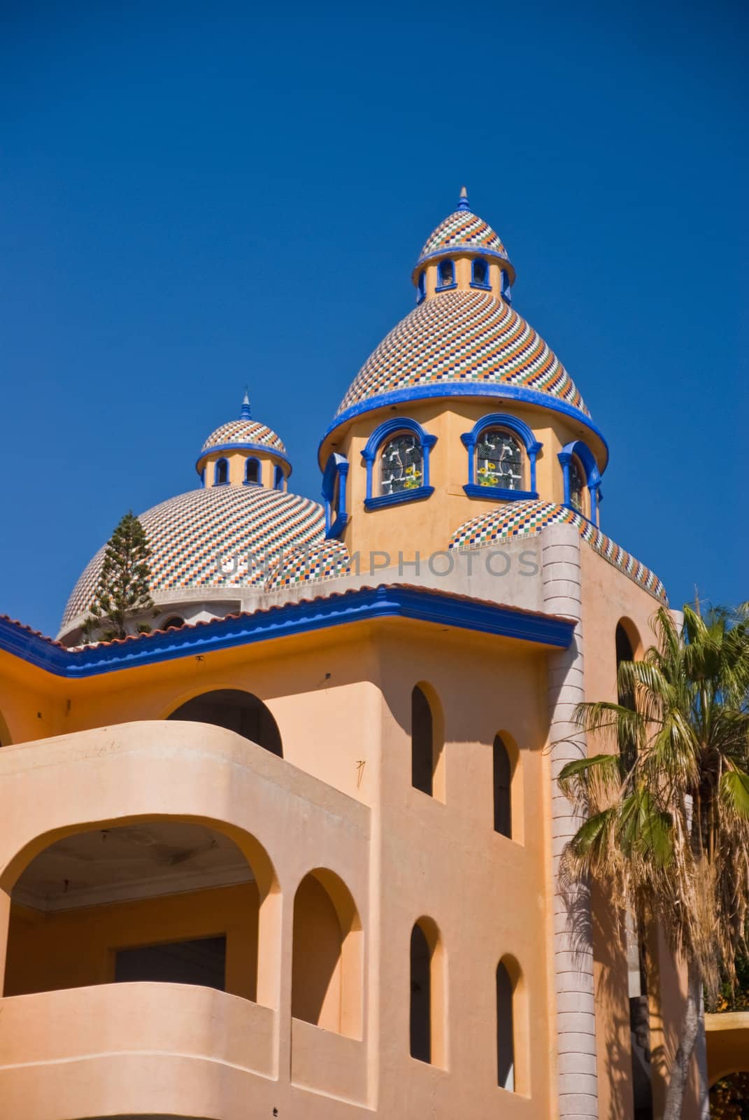 Colorful tiled dome Mexican building by emattil