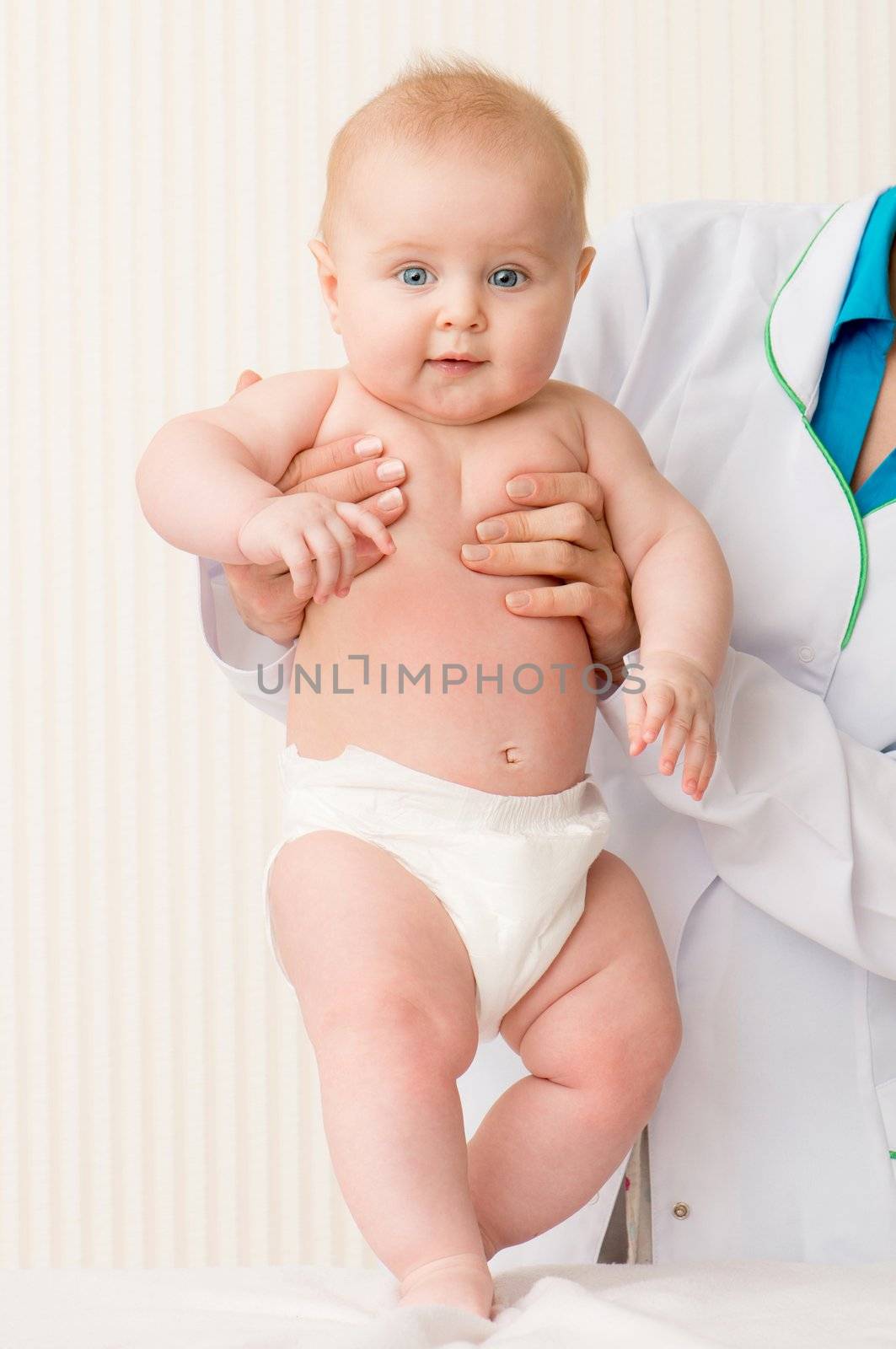 Smiling doctor with beautiful baby