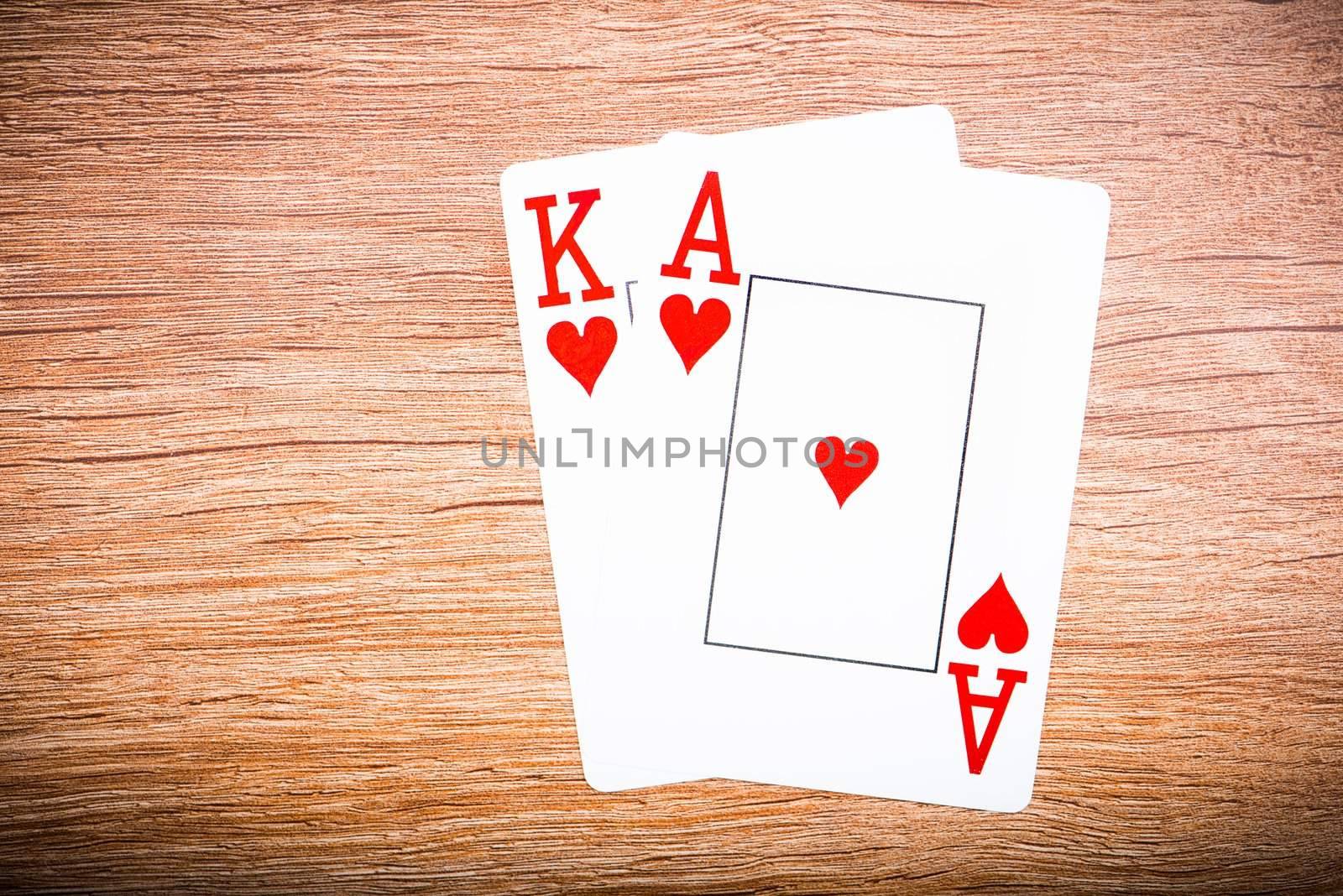 playing cards on a wooden background