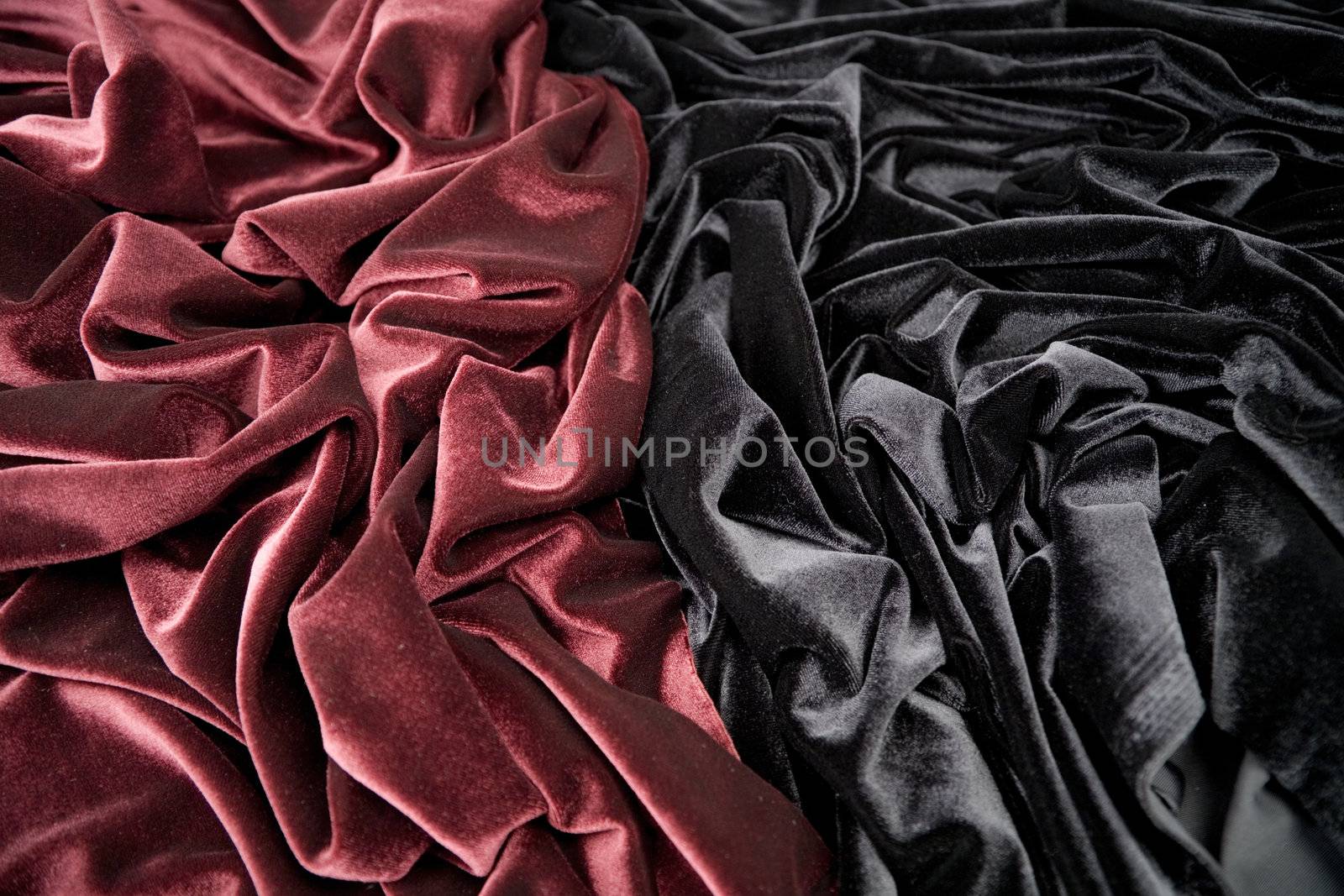 darkly-red and black glossy velvet is formative folds and light-shadow picture