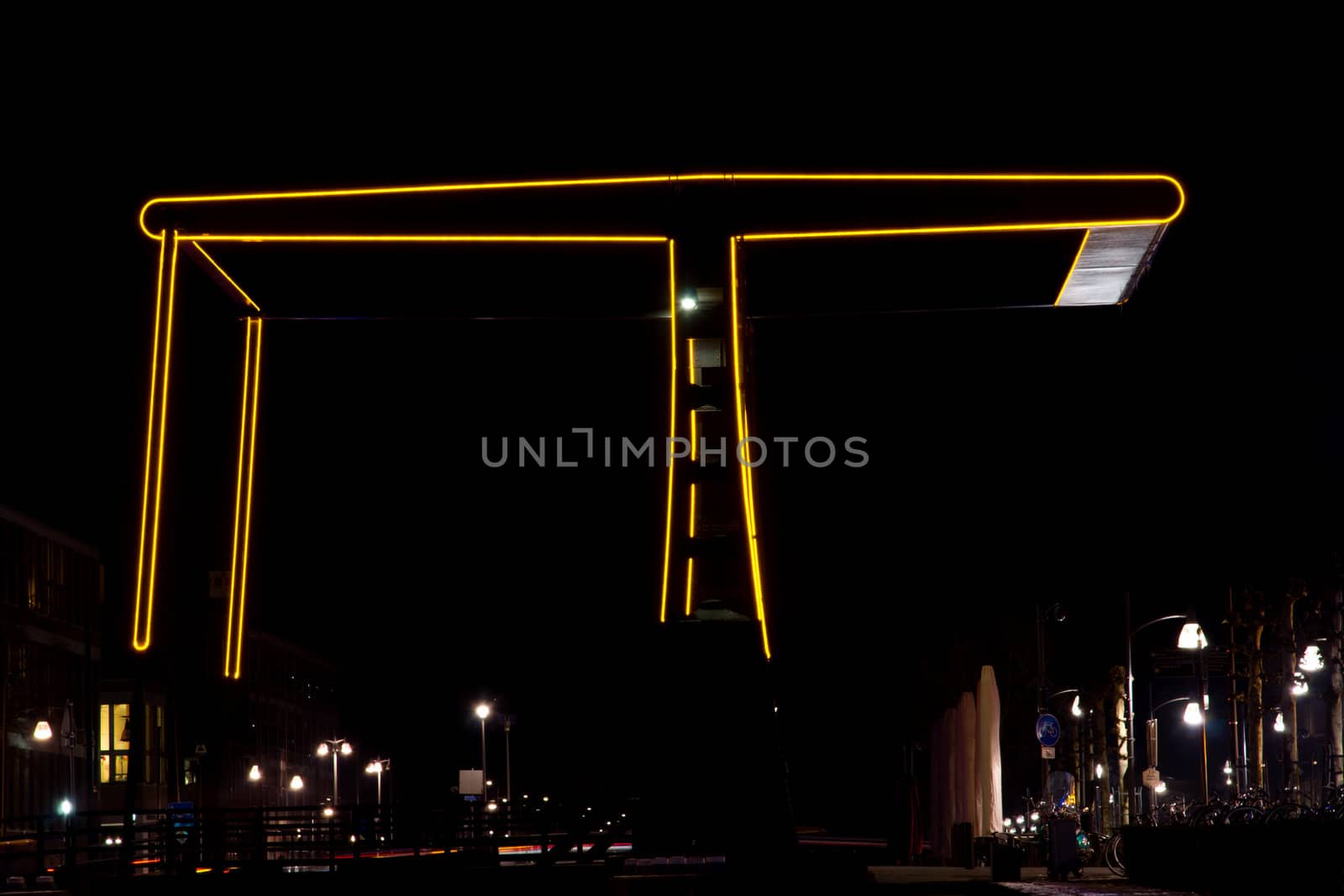 Lighted silhouette of a bridge at night