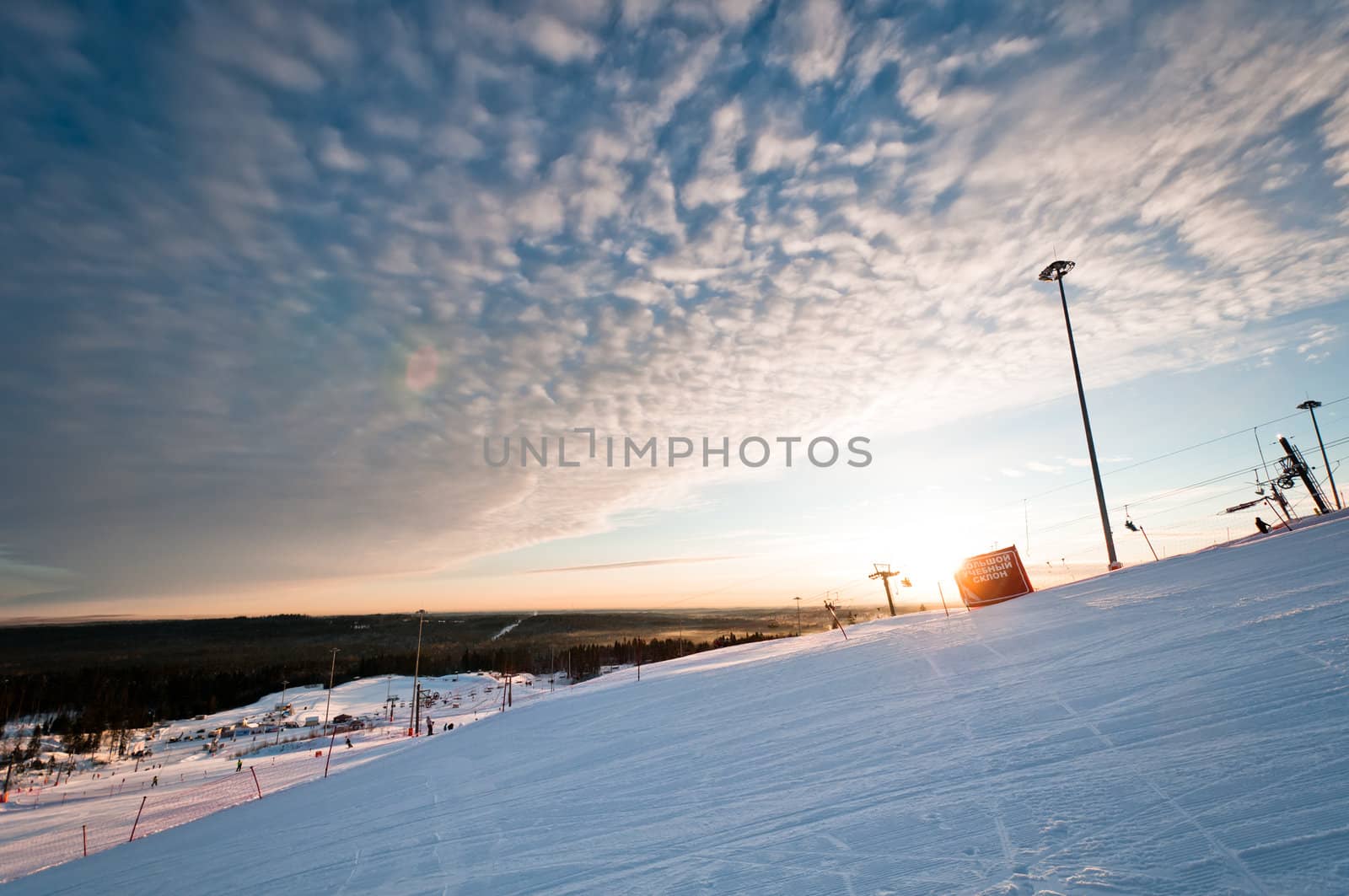 Ski resort slope at sunrise by dmitryelagin