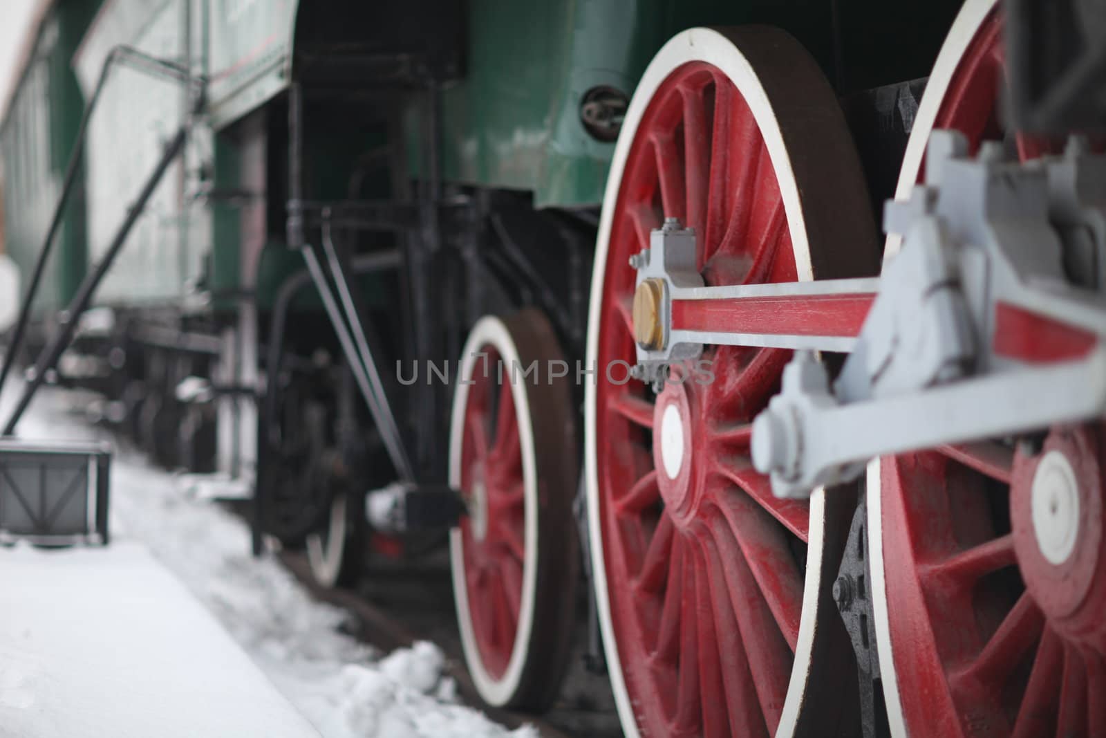 The wheels of the old steam locomotive, a fragment, close-up