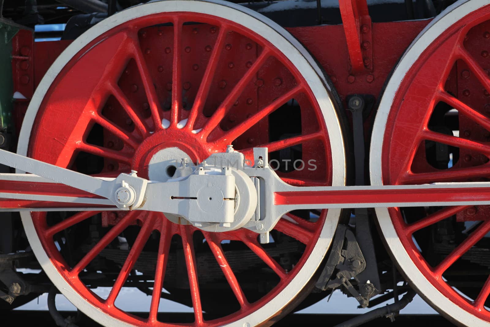 The wheels of the old steam locomotive, a fragment, close-up