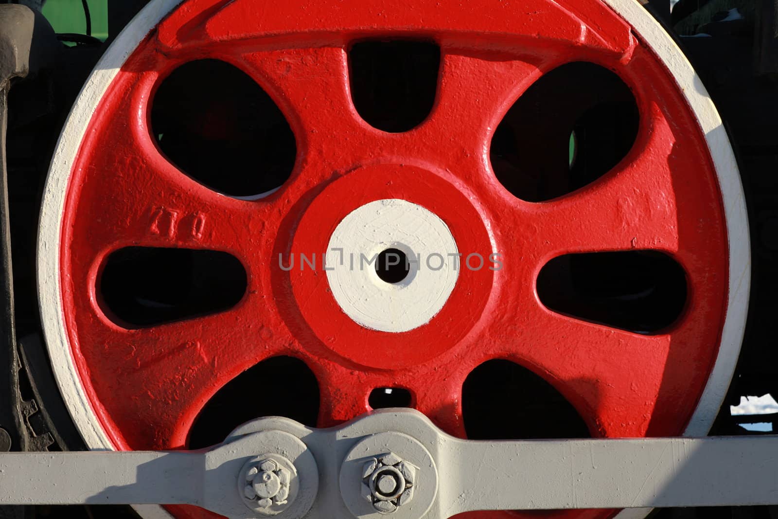 The wheels of the old steam locomotive, a fragment, close-up