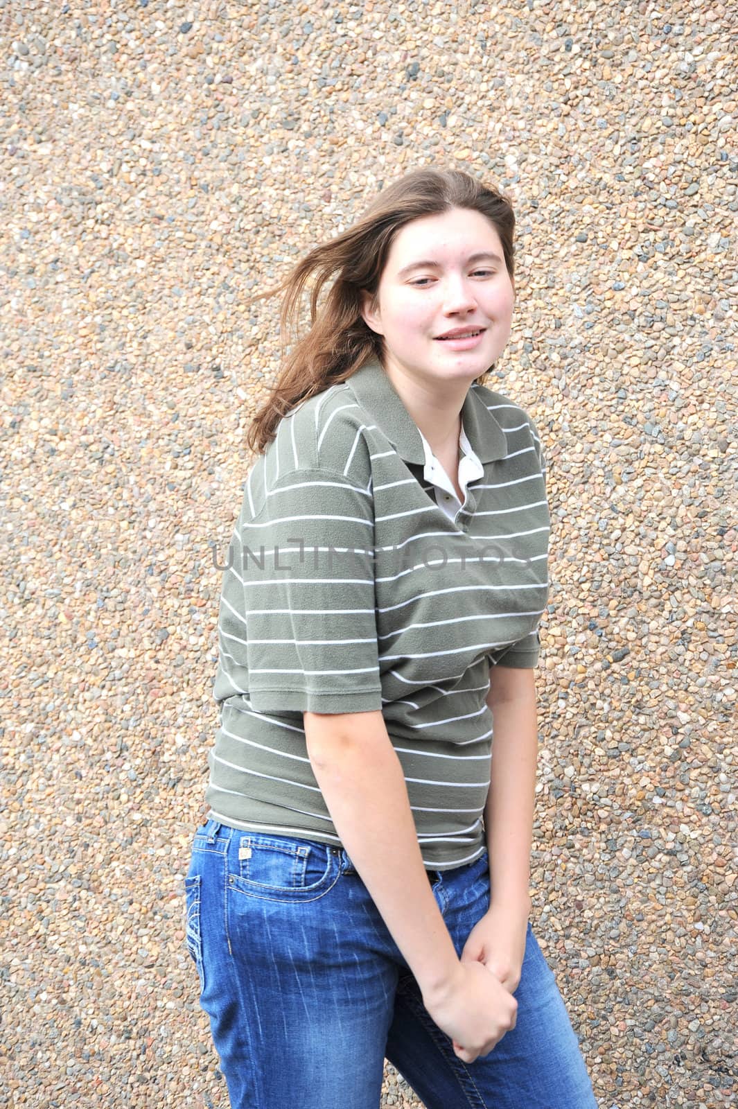 Female tomboy posing outside.