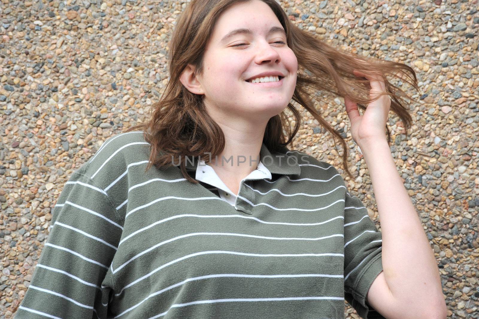 Female tomboy posing outside.