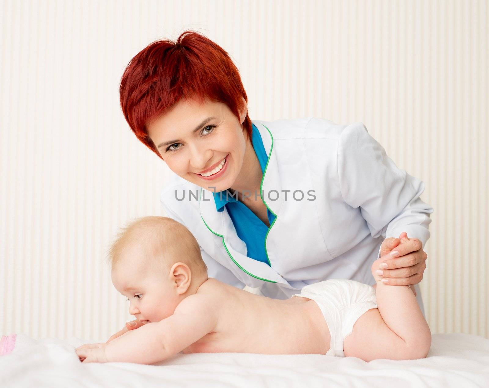 Smiling doctor with beautiful baby