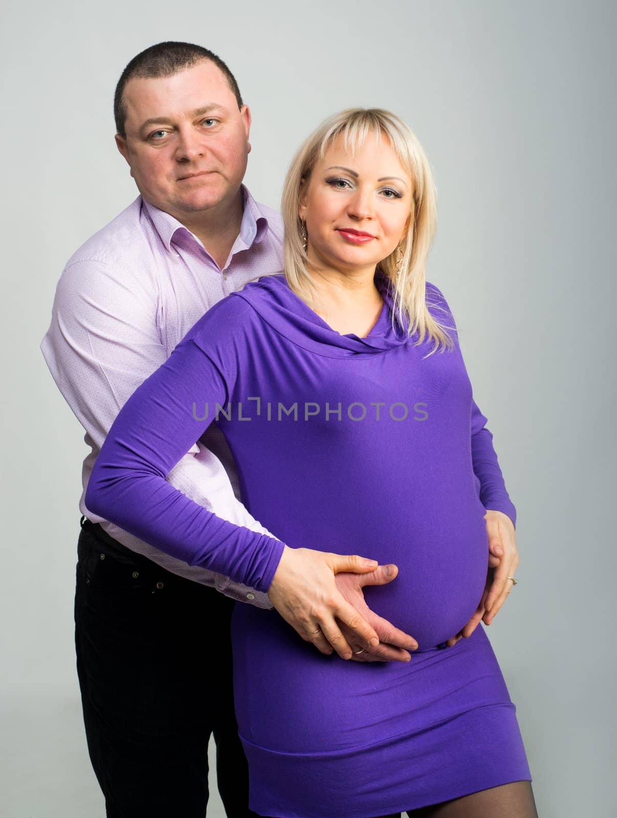 Portrait of a happy pregnant woman with her husband