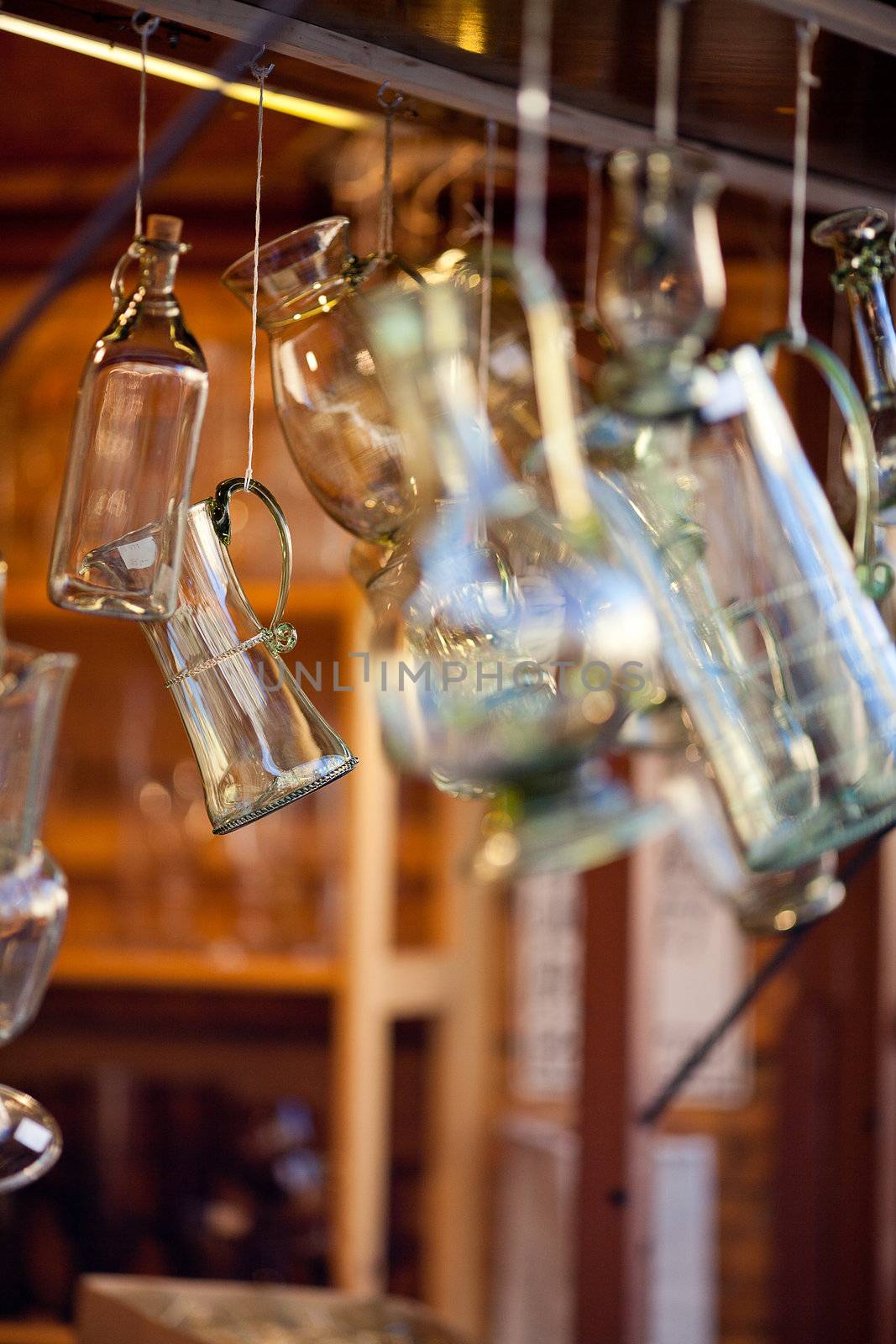 decanters of bohemian glass hanging on hooks