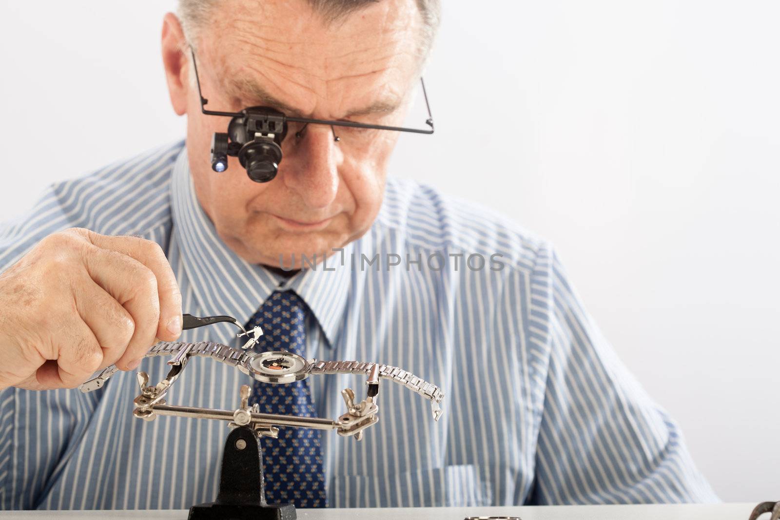 Older Man Repairing Watchmaker by Daniel_Wiedemann