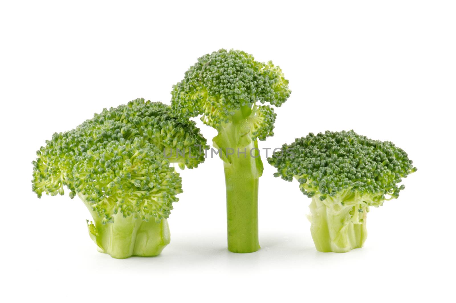 Three broccoli florets isolated on white background