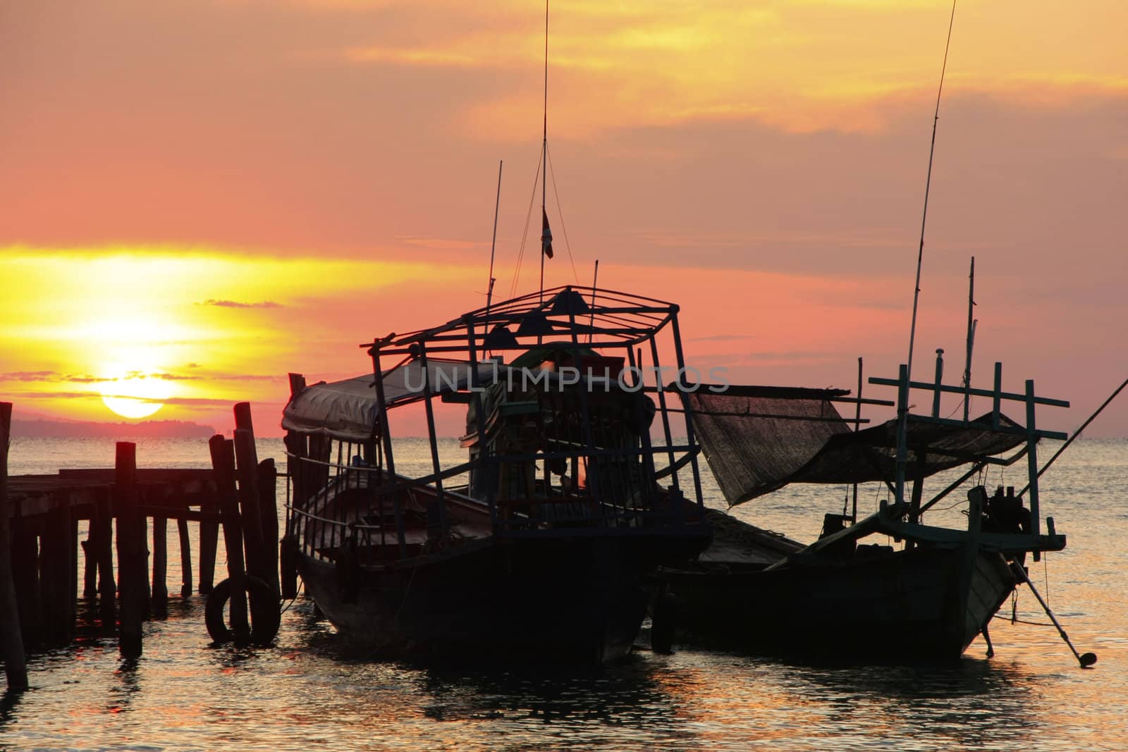 Silhouette of traditional fishing boat at sunrise, Koh Rong island, Cambodia, Southeast Asia