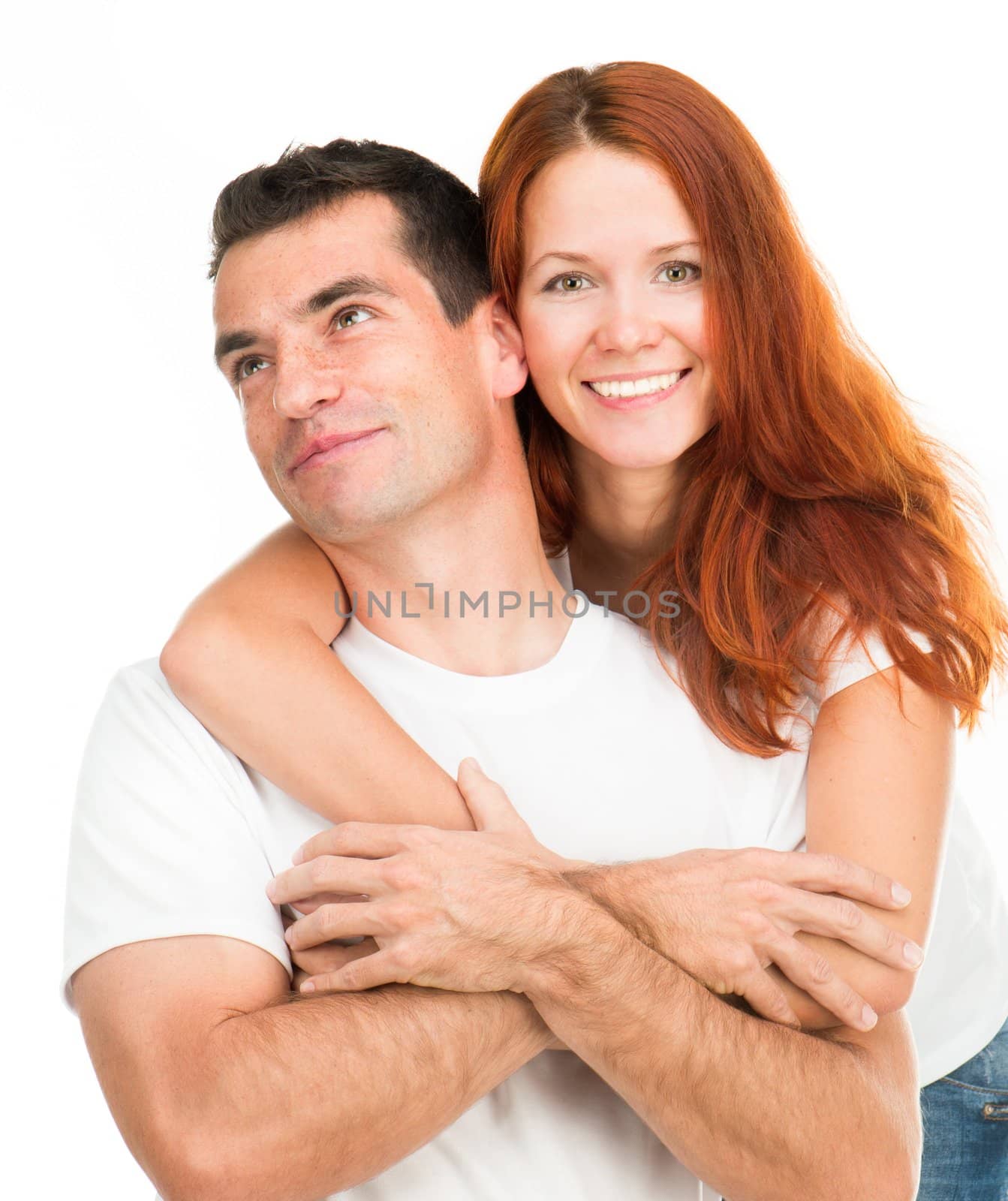 Young happy couple hugging on white background