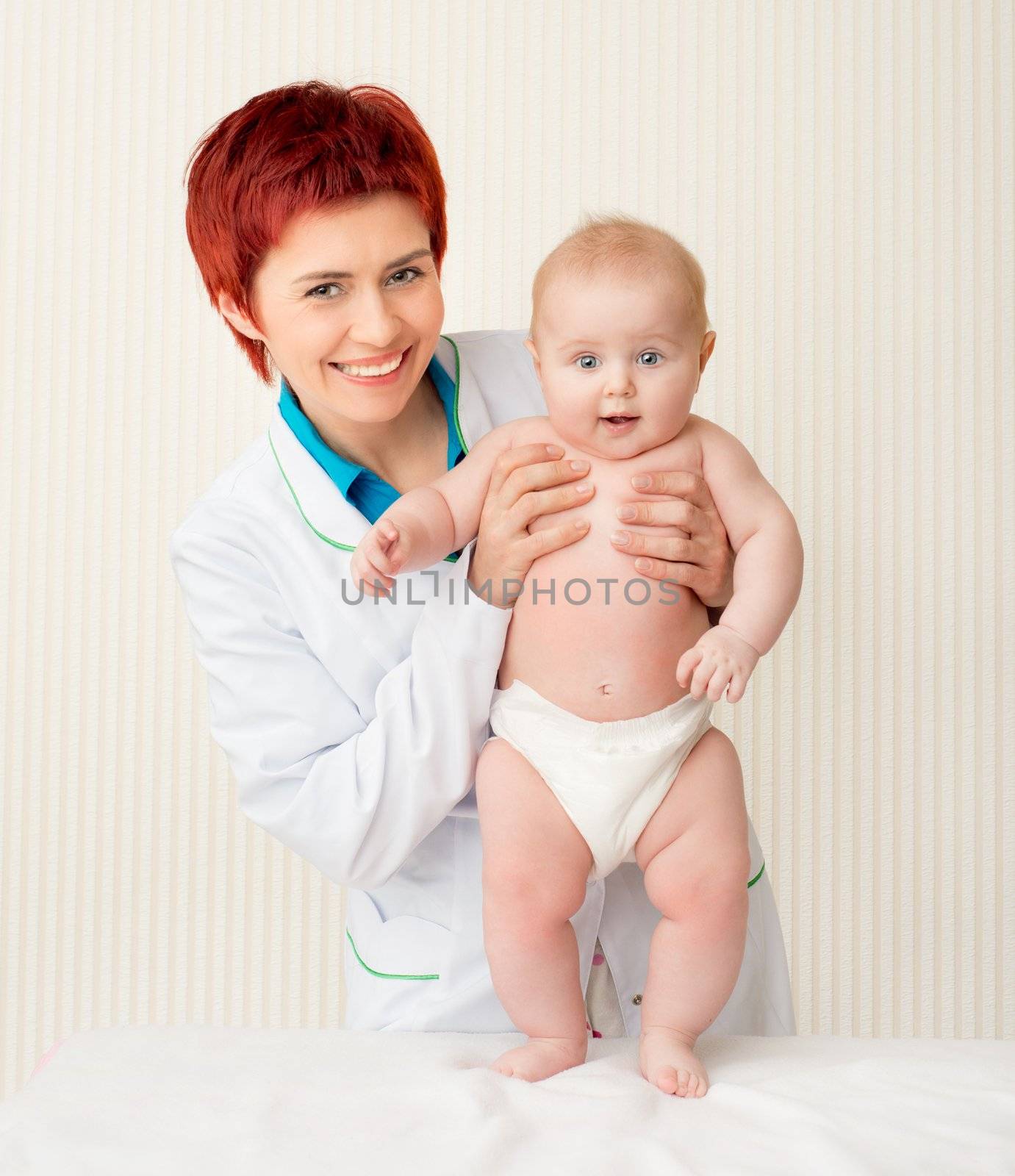 Woman doctor with beautiful baby
