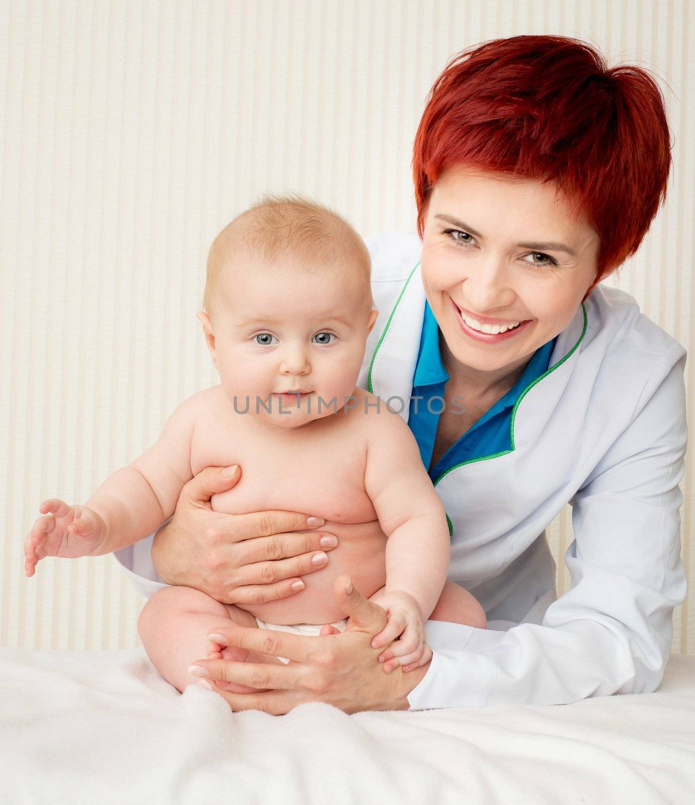 smiling doctor with small baby by GekaSkr