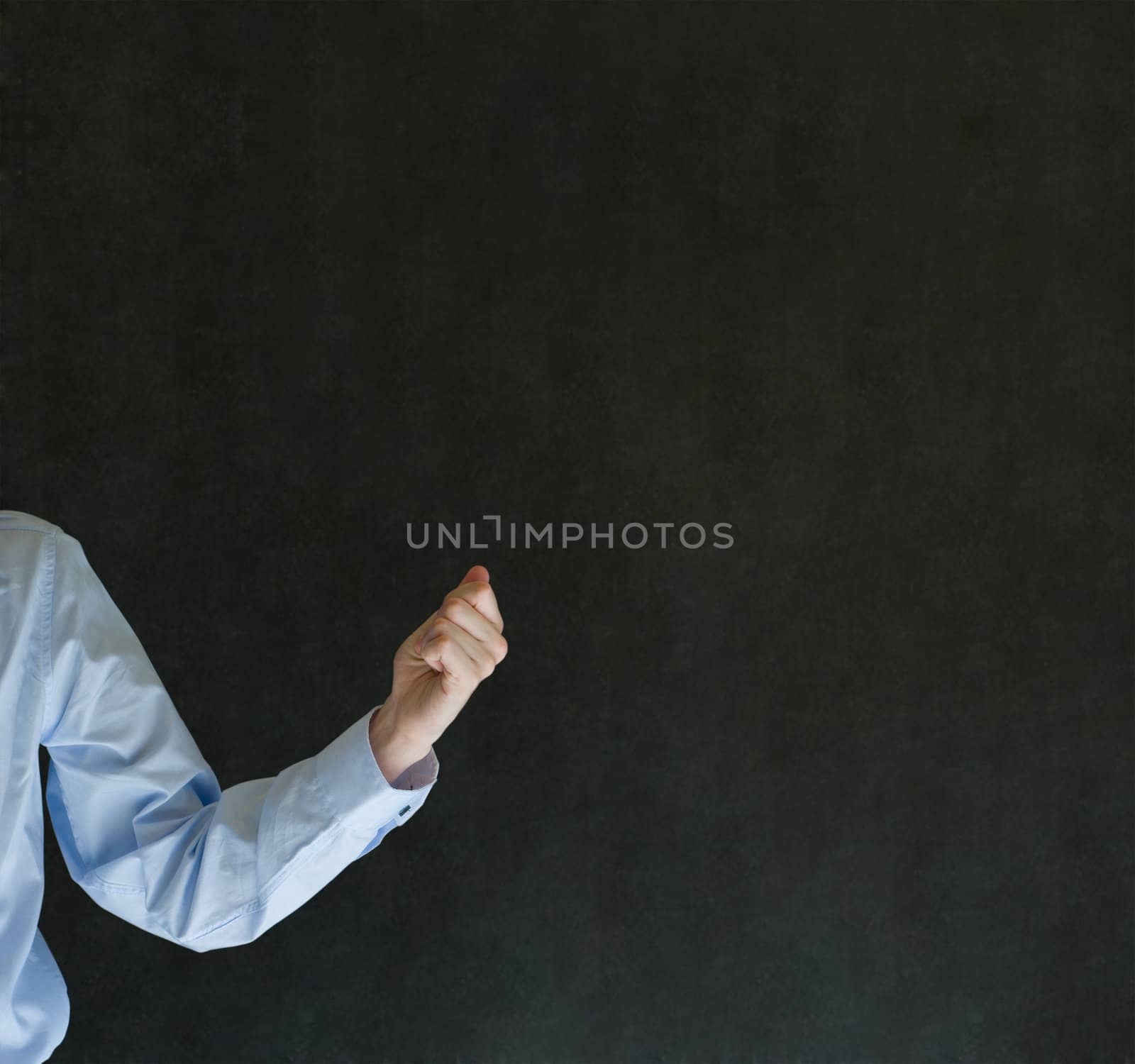 Man holding something or anything on blackboard background by alistaircotton