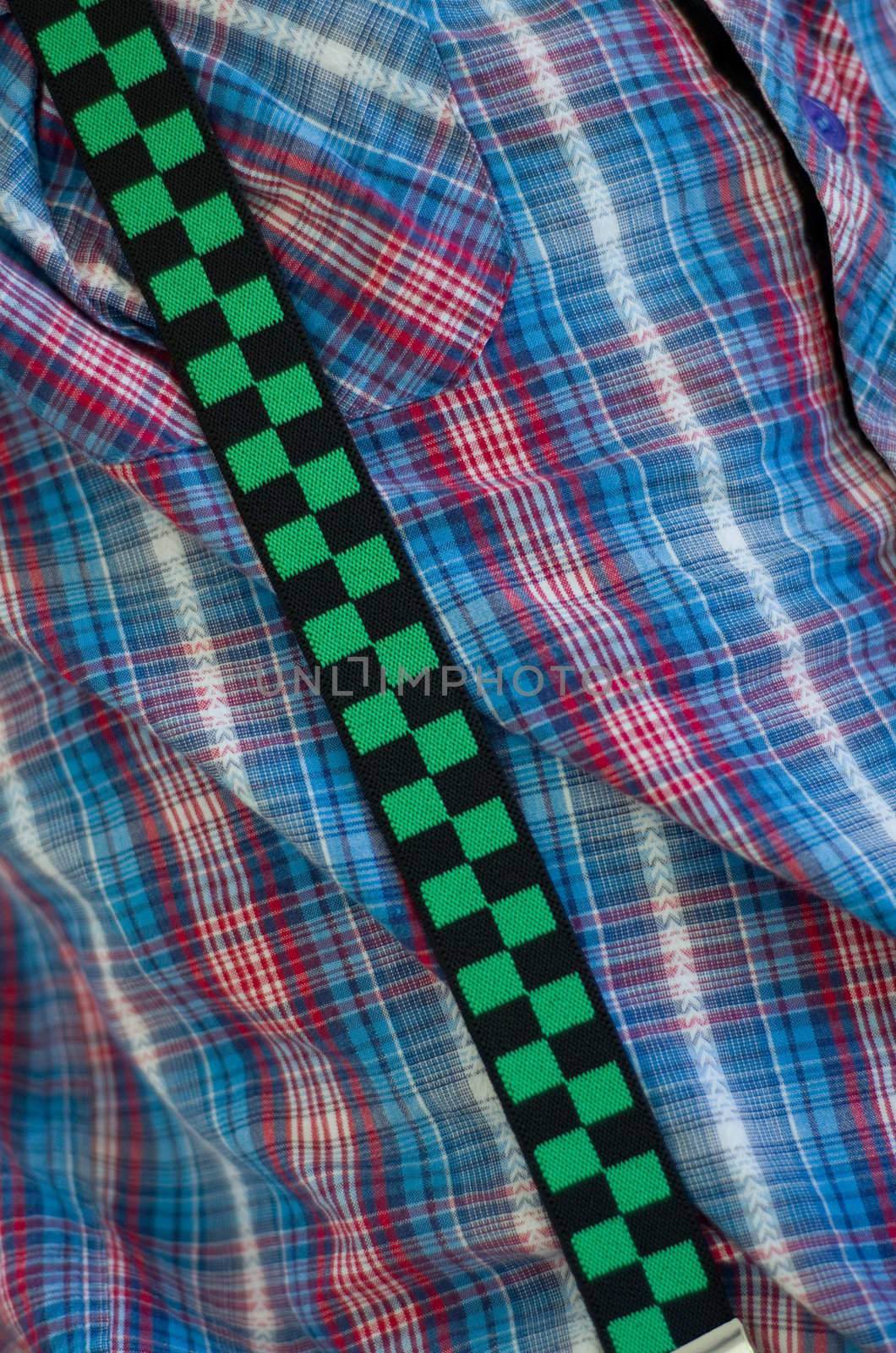 Funky chequered mens shirt braces on blue shirt