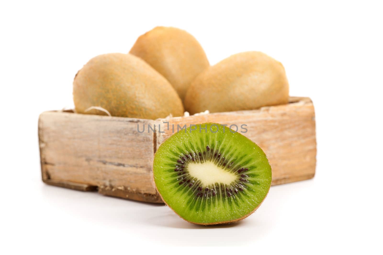 cross section of kiwi, isolated on white background.  by motorolka