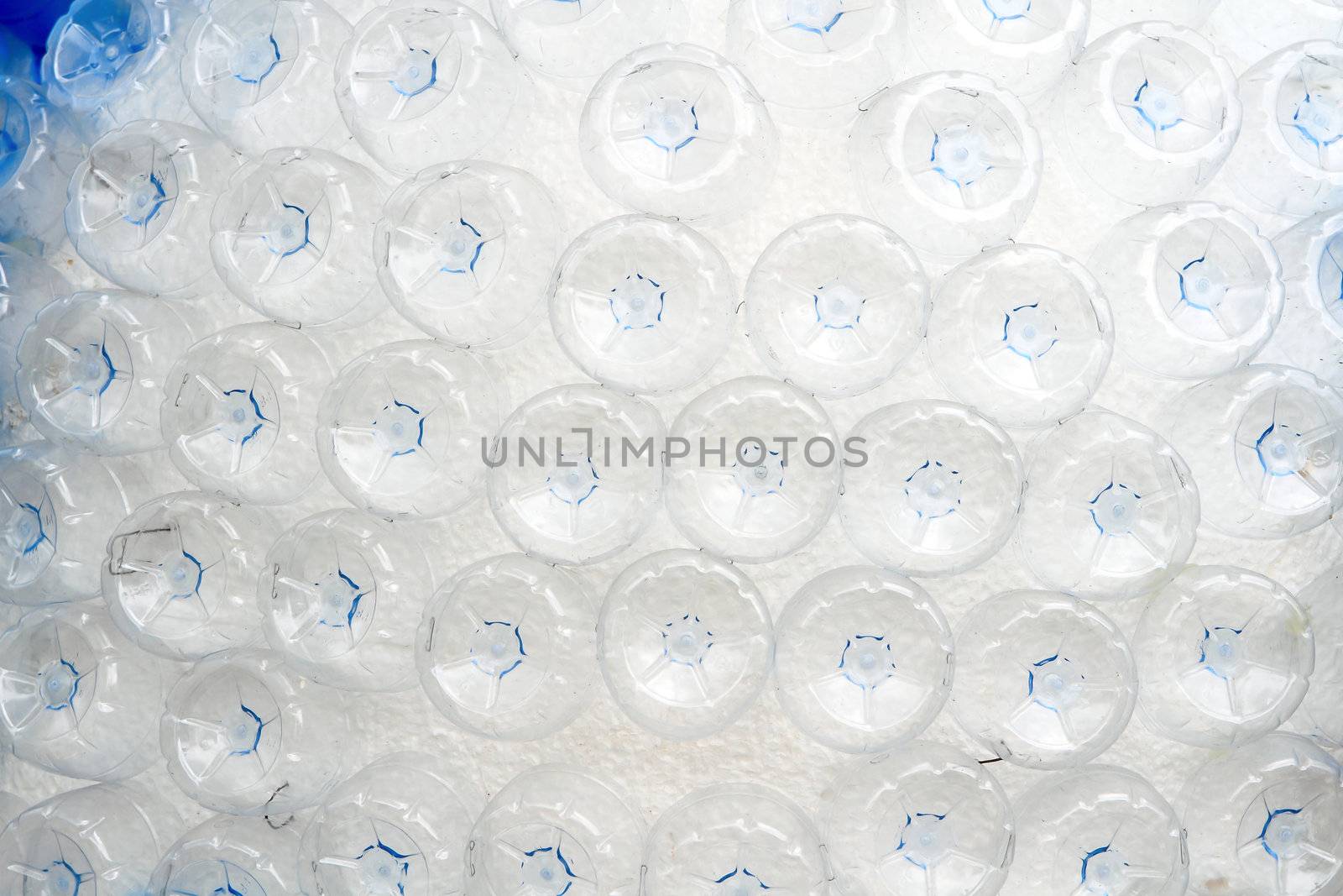 rows of empty plastic bottles at bottling plant 
 by rufous