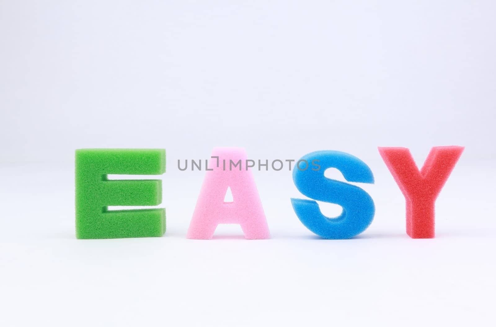 Easy word spelled out on white background