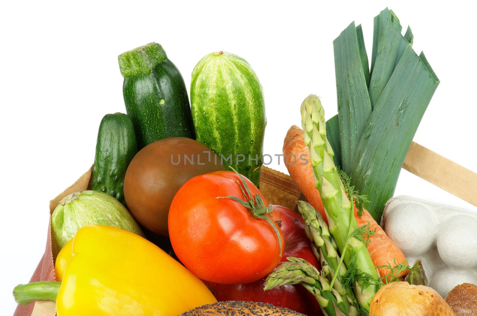 Groceries Bag with Vegetables, Greens, Fruits, Container of Eggs and Bread isolated on white background