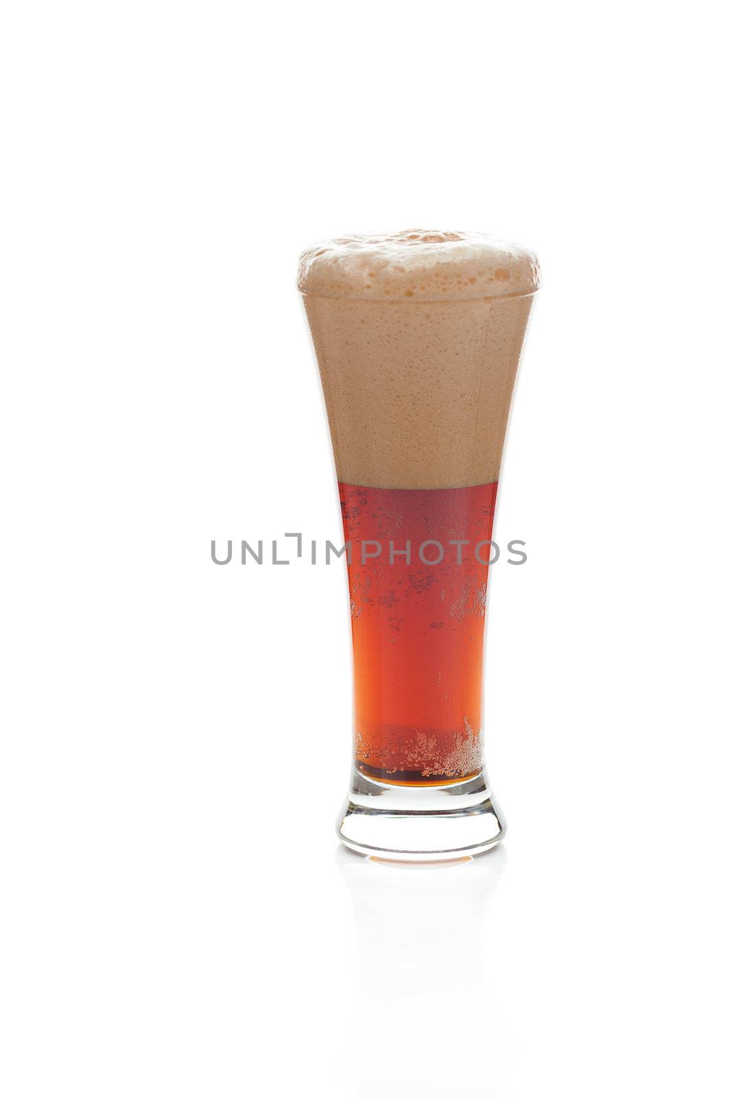 dark beer with the foam in a tall glass isolated on white