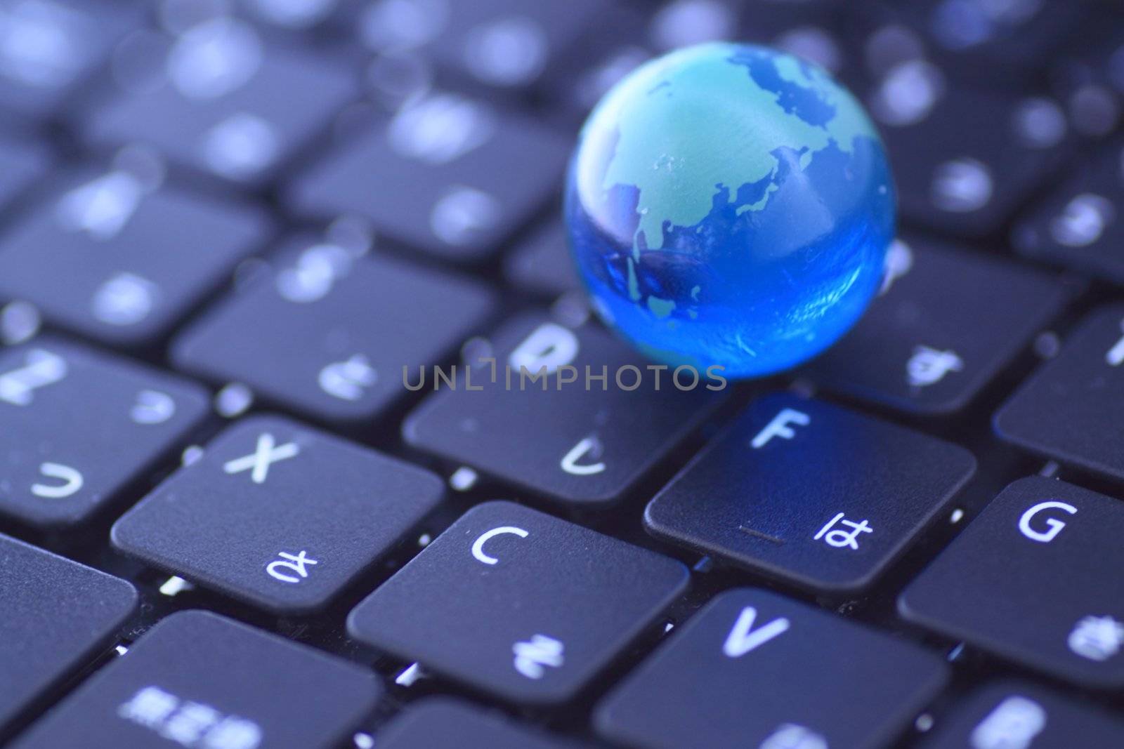 close up a Glass globe over the keyboard
