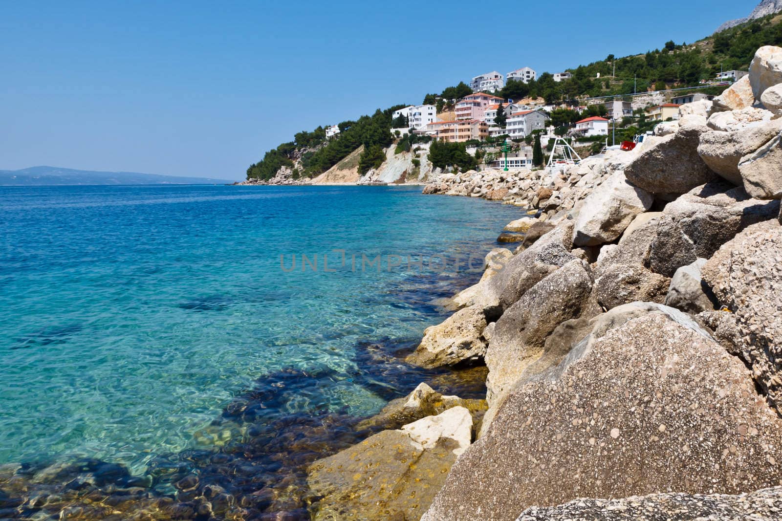 Blue Sea with Transparent Water and Rocky Beach in Croatia
