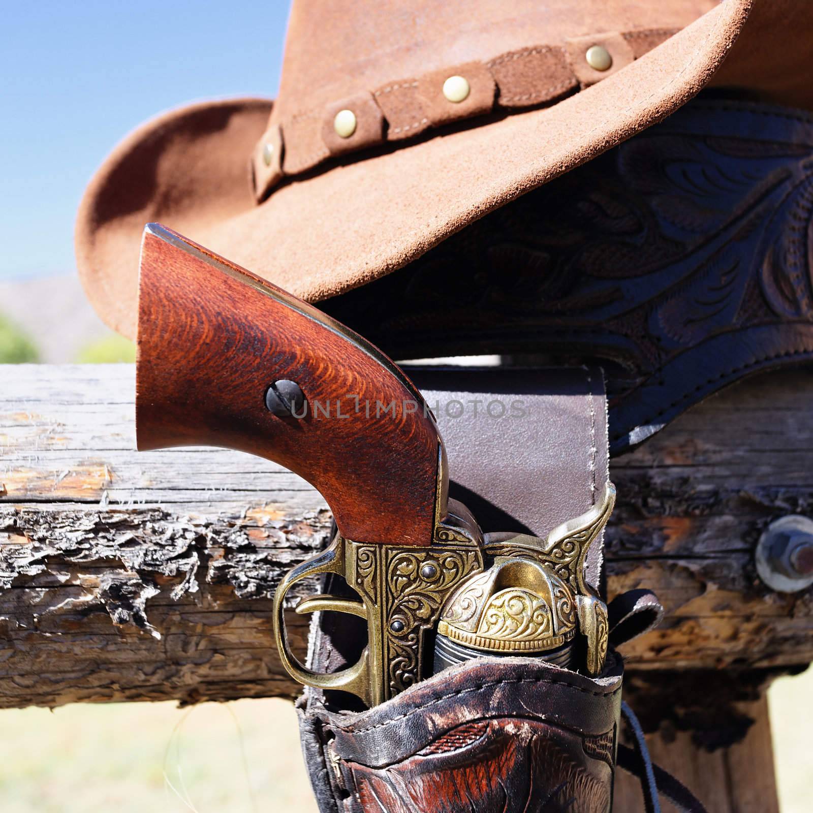 gun and hat outdoor under sunlight