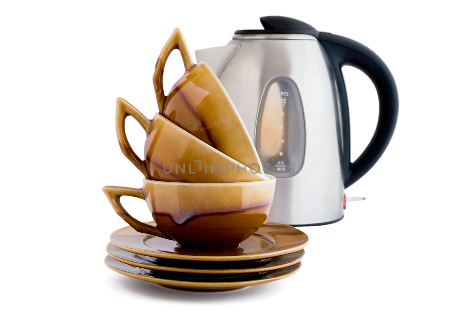 Three brown cups and kettle on a white background