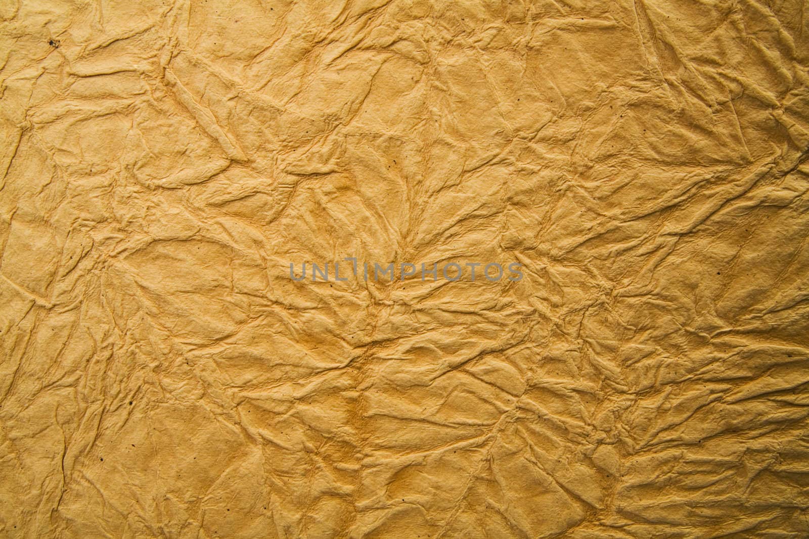 yellow rumpled paper as an ancient background